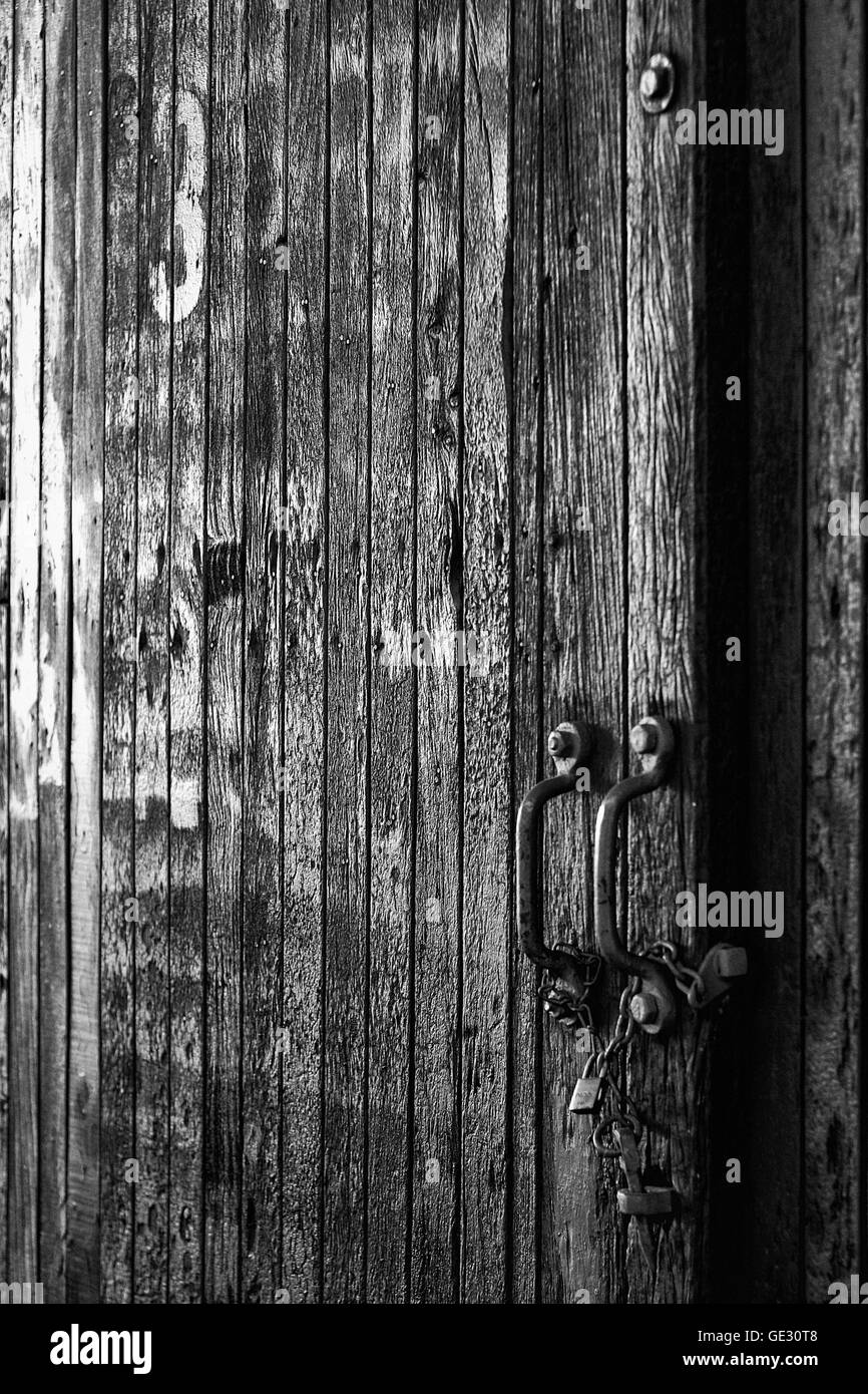 Wooden door picture of an old and abandoned train (Black & White) Stock Photo