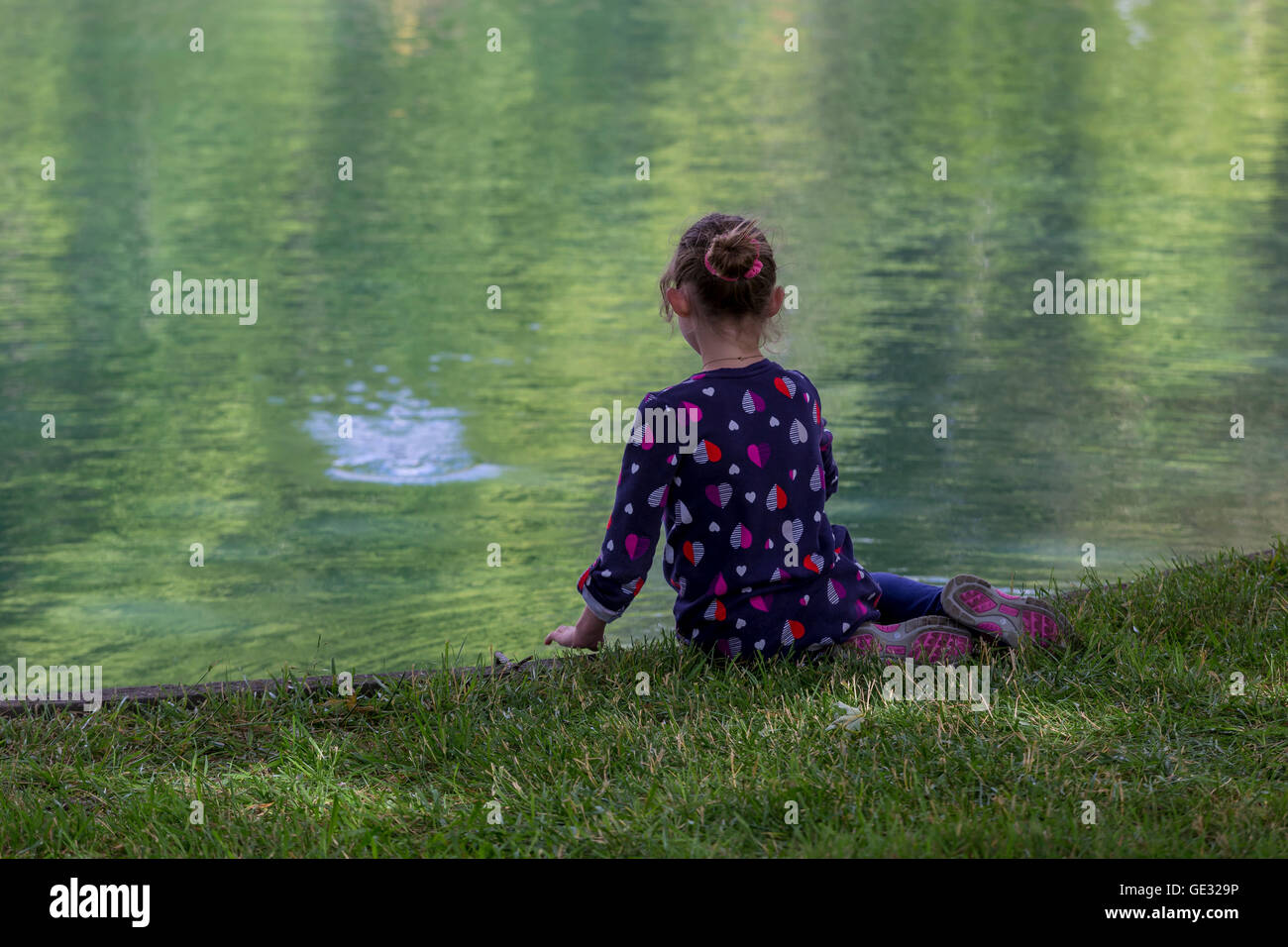 young girl, sitting, pond, Sonoma State University, city, Rohnert Park, Sonoma County, California Stock Photo
