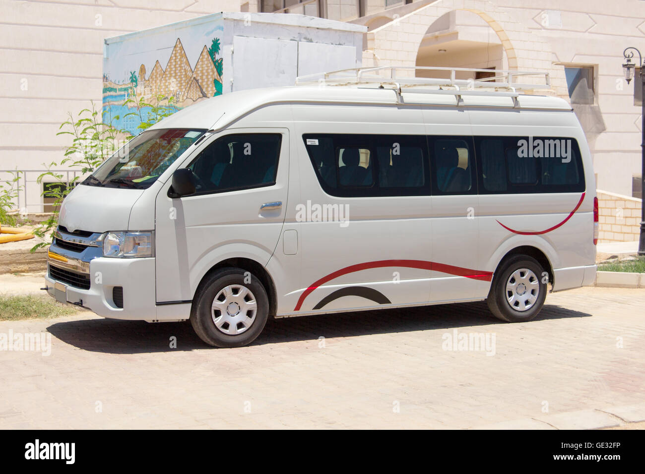 White commercial passenger mini bus waiting for tourists Stock Photo