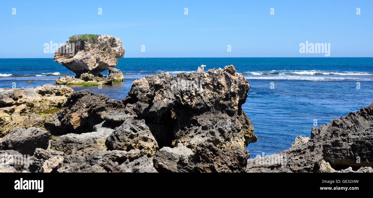 Rugged limestone coast at Point Peron with Indian Ocean waves and large ...