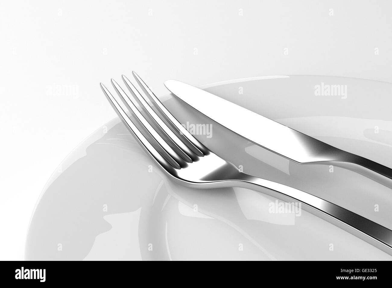Fork and knife with plates Stock Photo Alamy