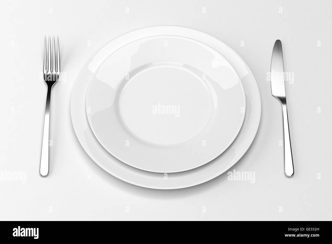 Fork and knife with plates Stock Photo Alamy