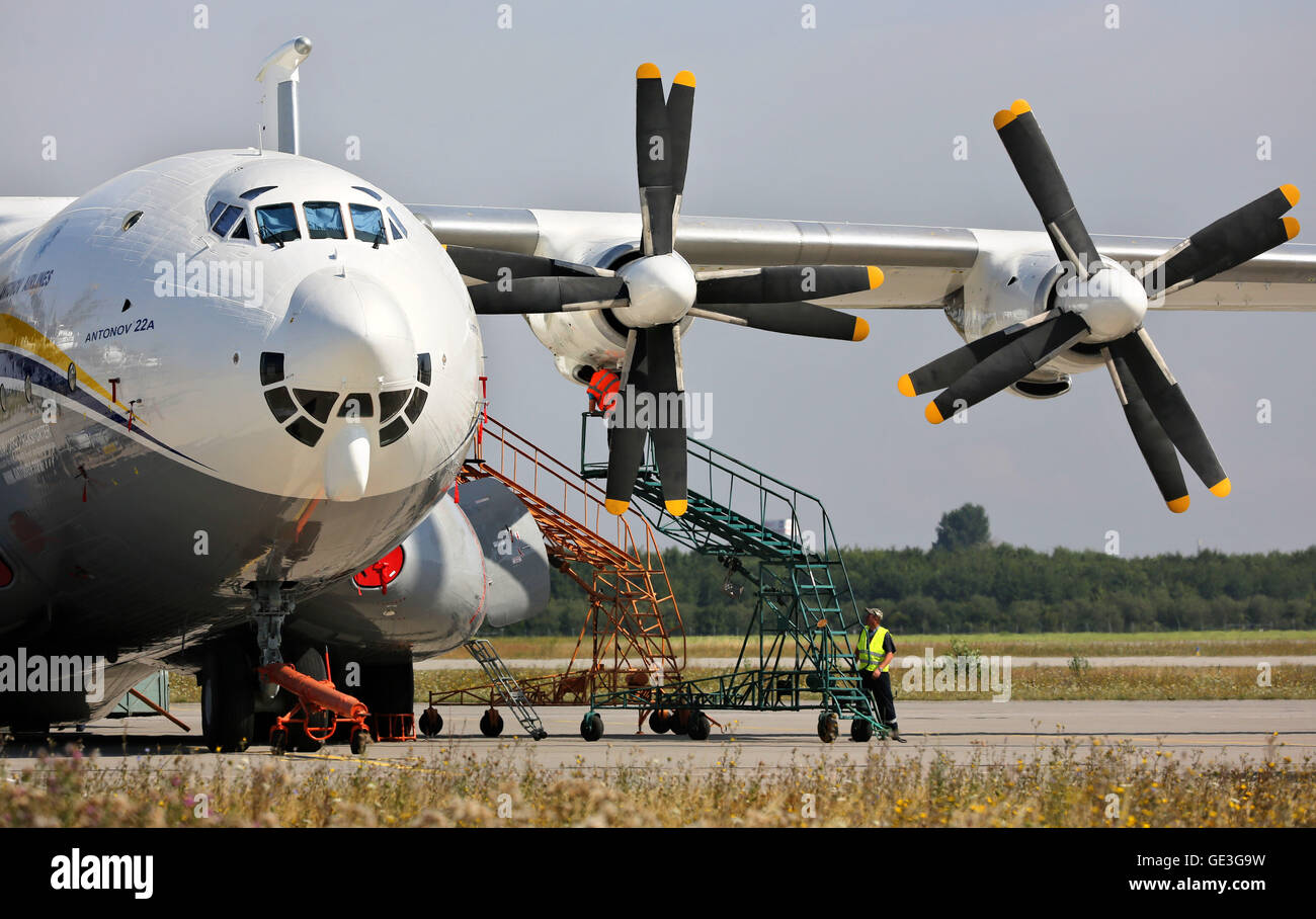 Schkeuditz, Germany. 22nd July, 2016. A technician checks the engines of an Antonov AN22 at the