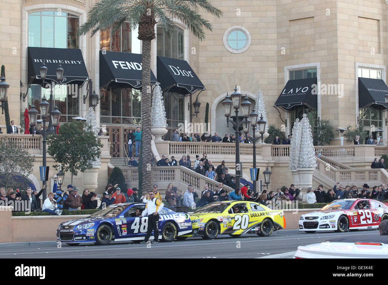 LAS VEGAS, NV - DECEMBER 5: Jimmie Johnson, Matt Kenseth and Kevin Harvick pictured in their racecars during the NASCAR Victory Lap fan experience featuring celebratory burnouts and drivers performing donuts on Las Vegas Blvd in Las Vegas, Nevada during NASCAR Champion's Week on December 5, 2013. Credit: mpi34/MediaPunch Inc. Stock Photo