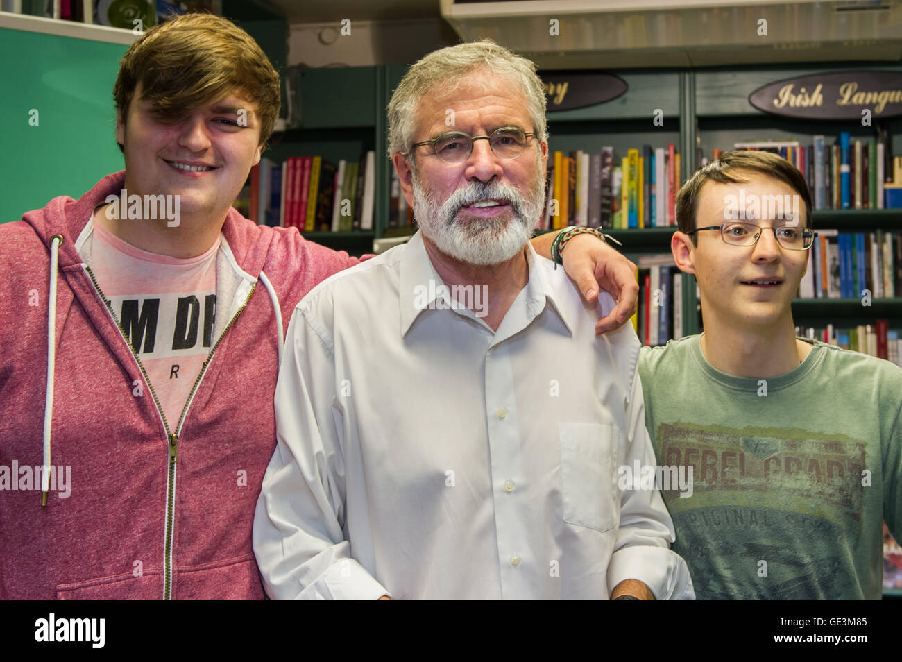 Cork, Ireland. 22nd July, 2016. Gerry Adams, the President of Political Party Sinn Féin was in Liam Ruiseal's Bookshop in Oliver Plunkett Street, Cork, on Friday 22nd July, signing his new book - 'My Little Book of Tweets'. Stephen Kingsley and Conor O'Carroll, both from Ballincollig, got their copy of the book signed by Mr Adams. Credit: Andy Gibson/Alamy Live News. Stock Photo