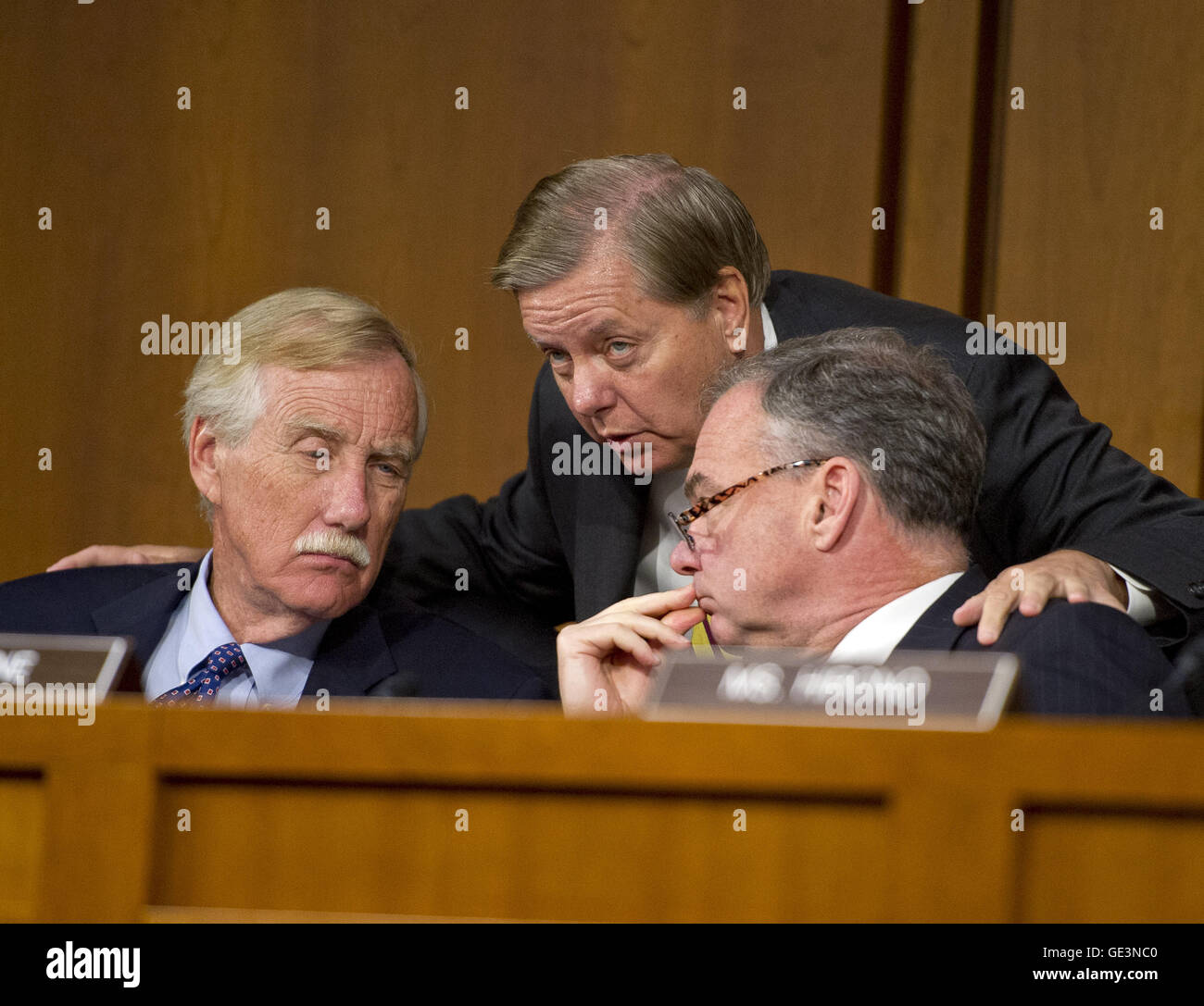 September 16, 2014 - Washington, District of Columbia, United States of America - United States Senators Angus S. King, Jr. (Independent of Maine), left, Lindsey Graham (Republican of South Carolina), center, and Tim Kaine (Democrat of Virginia), right, share some thoughts as U.S. Secretary of Defense Chuck Hagel and Chairman, Joint Chiefs of Staff, General Martin E. Dempsey, U.S. Army, deliver testimony before the U.S. Senate Committee on Armed Services on the U.S. policy towards Iraq and Syria and the threat posed by the Islamic State of Iraq and the Levant (ISIL) in Washington, DC on Tues Stock Photo