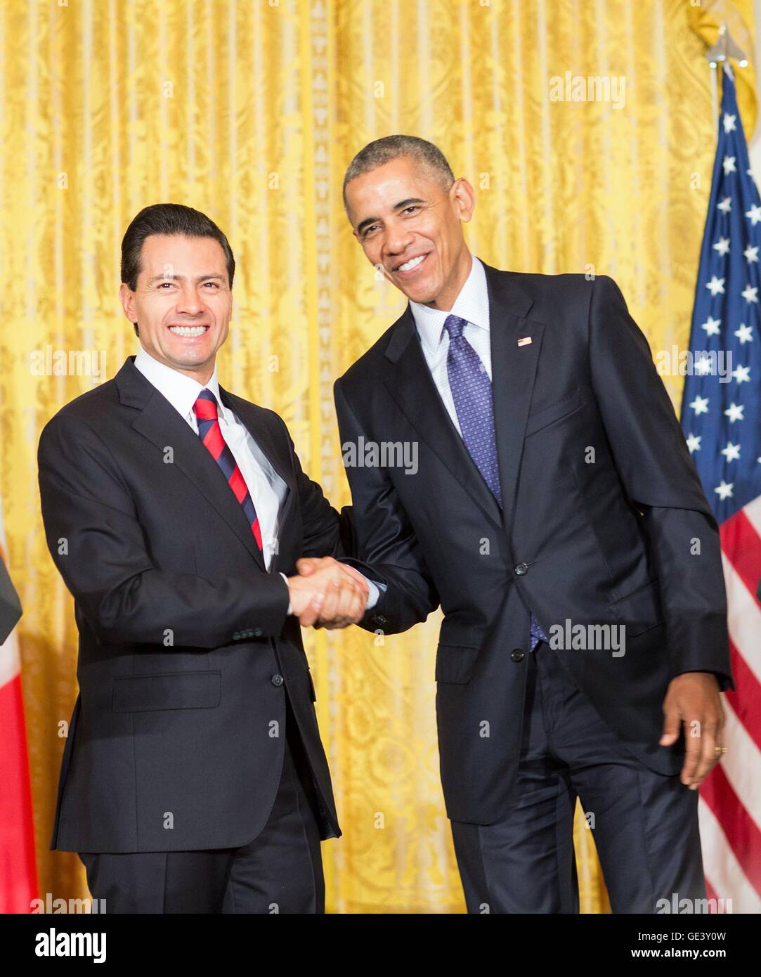 U.S President Barack Obama shakes hands with Mexican President Enrique Pena Nieto following their joint press conference in the East Room of the White House July 22, 2016 in Washington, DC. Stock Photo
