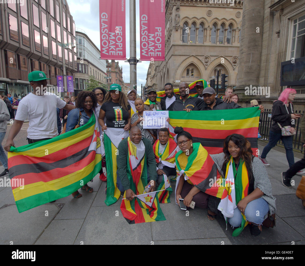 Glasgow, Scotland, UK 23rd  July 2016. Scotland’s Zimbabwean community gathered together in Glasgow today to support an international protest against the corruption in their home country of Zimbabwe. Chanting “Enough is enough!', they along with their fellow countrymen abroad, 50  Scottish residents joined the world wide protest organised through social media against the government and their president Robert Mugabe Credit:  Gerard Ferry/Alamy Live News Stock Photo