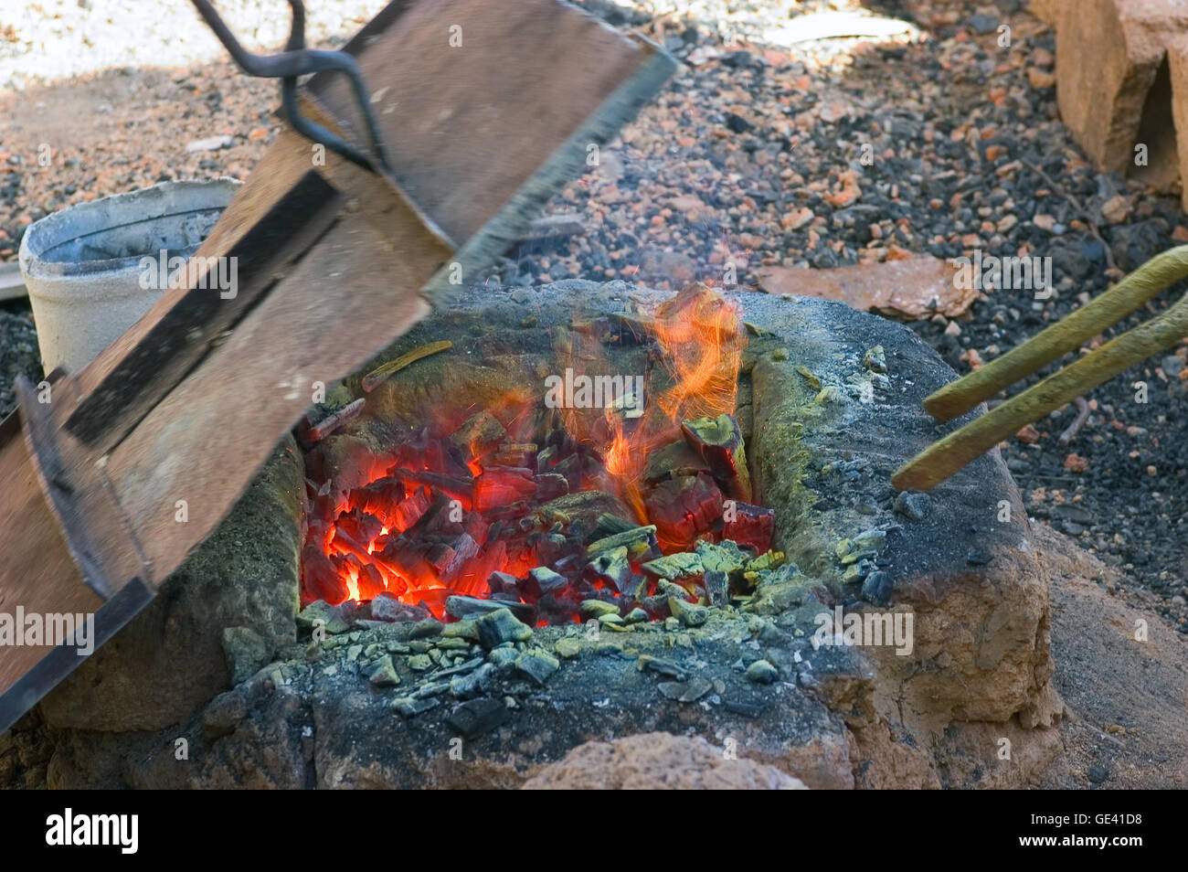 To dissolve bronze one needs a very high temperature, fire is then poked until arriving at the
