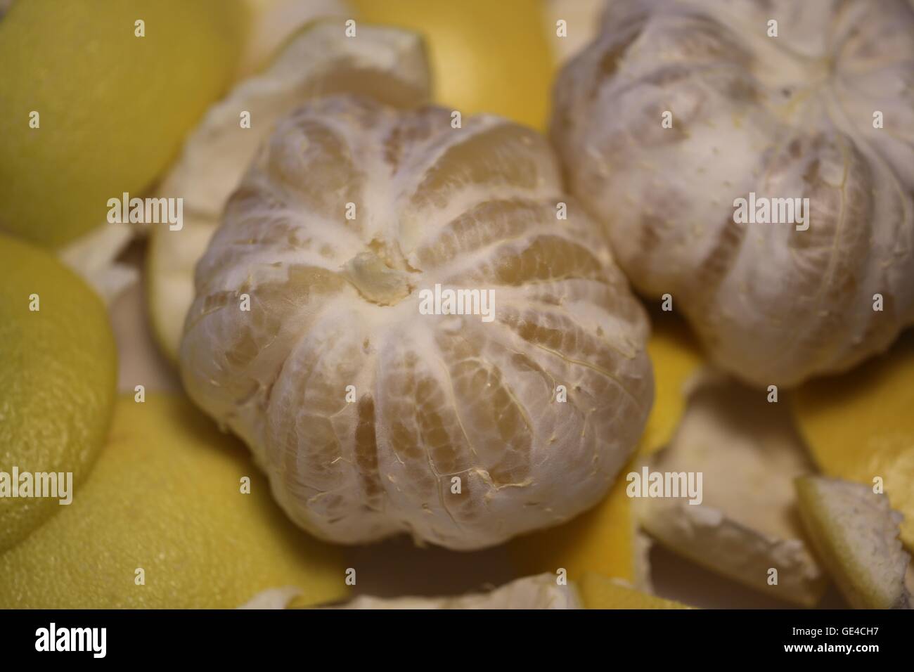 Sweetie. Sweetie - hybridization of grapefruit and pomelo. Fresh peeled sweetie without the thick peel, before separating the individual segments. Stock Photo