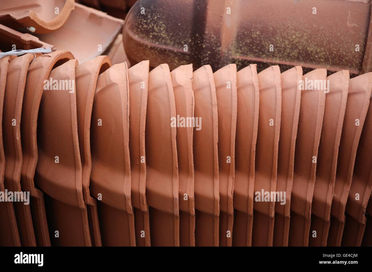 Roof Tiles.  Stack of new clay roof tiles. Stock Photo