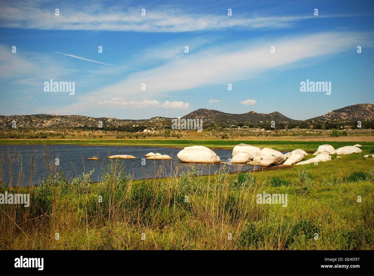Rocks in Lake Morena with sky and mountains Stock Photo Alamy