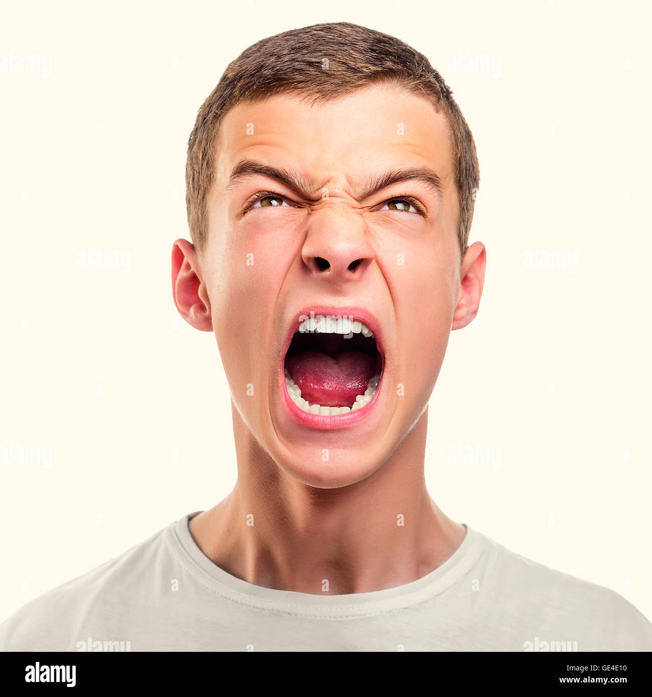 Portrait of young angry man. Toned photo Stock Photo - Alamy