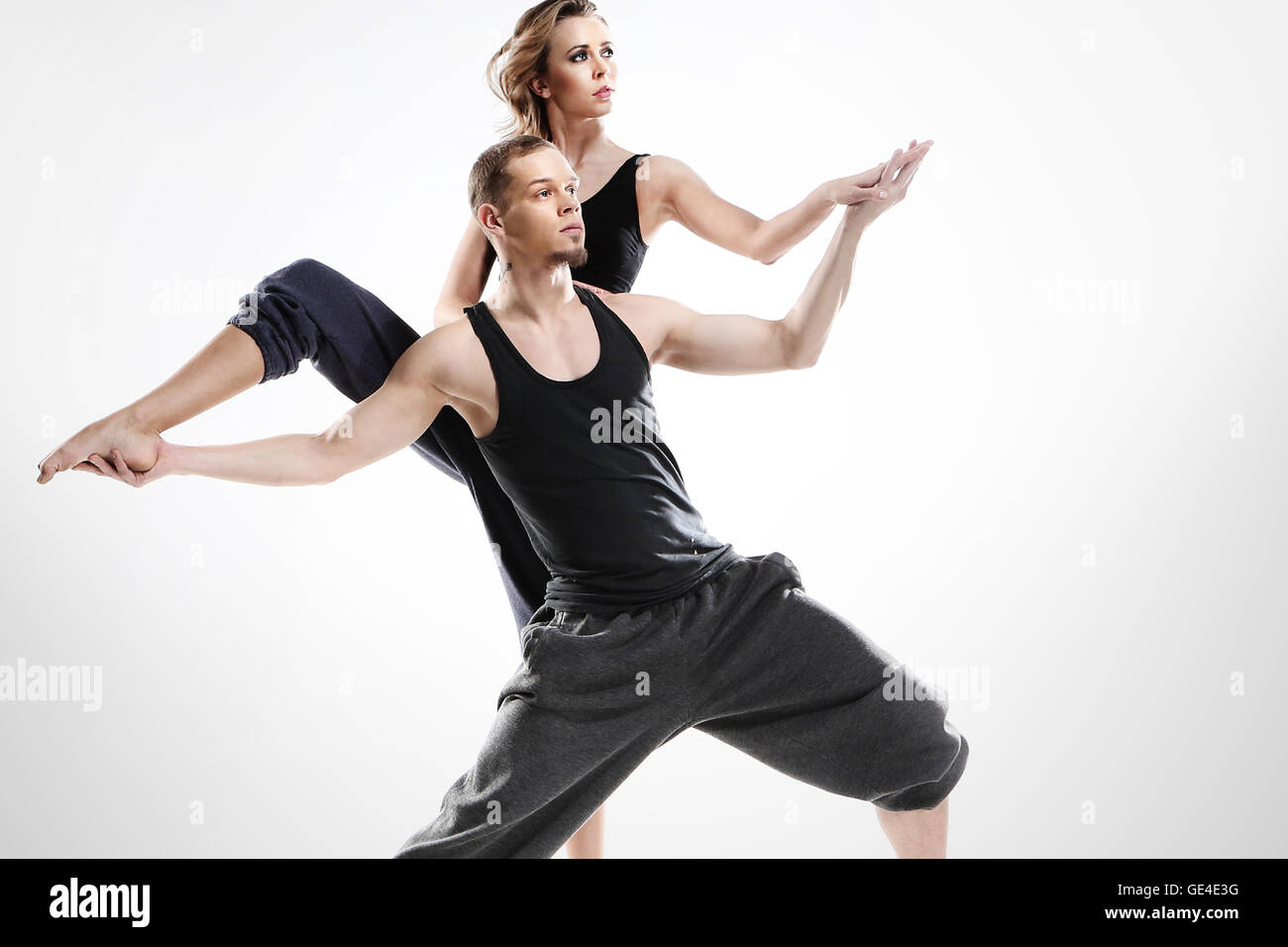 Modern dance,  A couple of young dancers in a dynamic pose. Taniec nowoczesny. Stock Photo