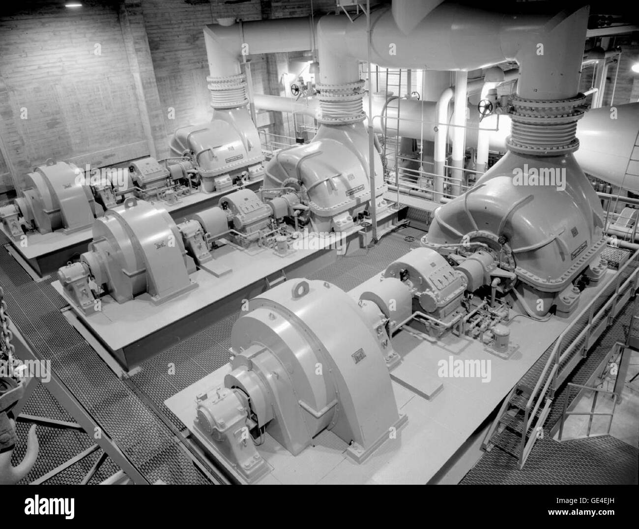 (291-87C): Three 4,000-horsepower compressors were installed with the 20-Inch SWT.  They worked in conjunction with other nearby compressors to serve all of the JPL’s tunnels.  The horizontal inlet portion of the 20-Inch SWT is visible in the background. Stock Photo