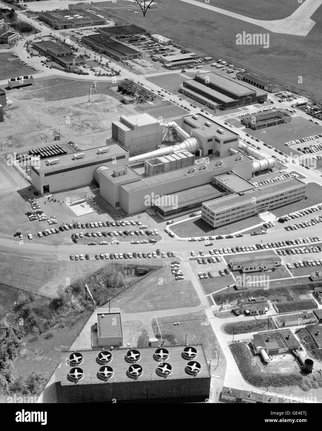 The National Advisory Committee for Aeronautics (NACA) Lewis Research Center 10ft x 10ft Unitary Supersonic Wind Tunnel is shown in the center of this picture. The Unitary Wind Tunnel Plan Act of Congress, a post-war act, stipulated that NACA wind tunnels were to be made available to industry for testing. This push was to encourage the improvement of existing aircraft engines. This aerial view shows the size of the facility. The Lewis Research Center is now known as the John H. Glenn Research Center.  Image # : C1956-42303 Date: March 23, 1956 Stock Photo
