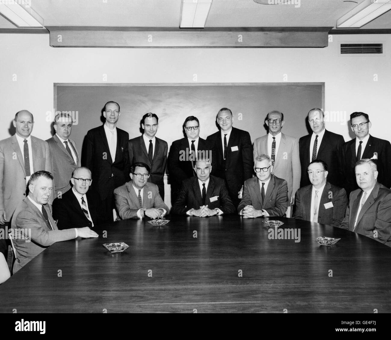 Atomic Energy Commission (AEC) officials with Abe Silverstein (front row, sitting third from left), working out the final reactor licensing issues. It is said that Silverstein told AEC Director Glenn Seaborg that the officials could not leave until a deal was struck. Because Plum Brook was a federal acility, it was not required to file for an AEC license, but to promote peace of mind in the nearby community and maintain safety, NASA officials decided to work through the commission. They received the AEC designation Test Reactor 3 (TR-3).  Image # : C-1964-69271 Stock Photo