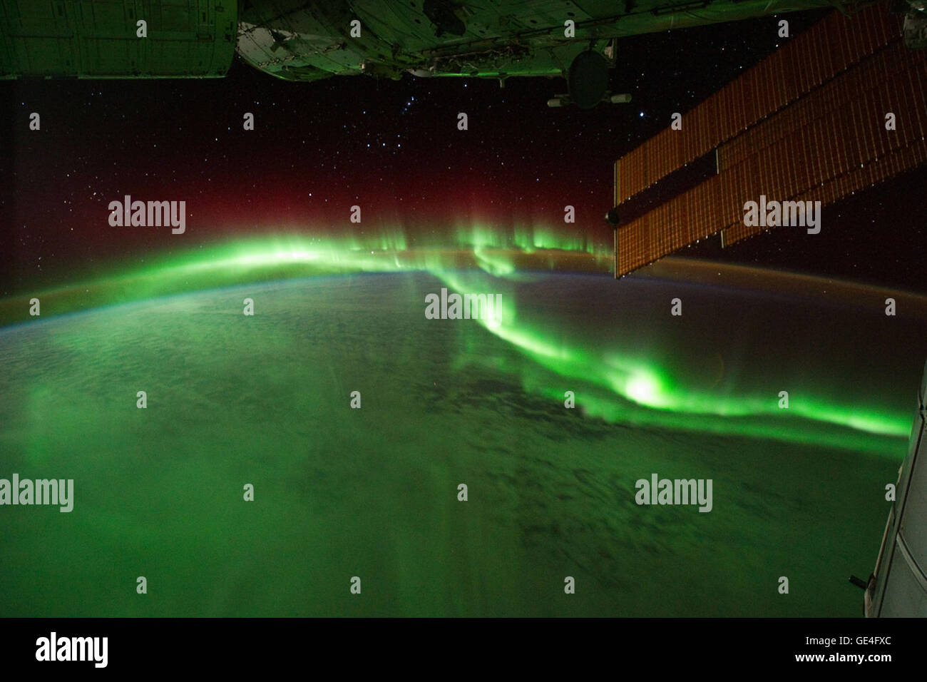Description Astronauts on the International Space Station (ISS) used a digital camera to capture several hundred photographs of the aurora australis, or “southern lights,” while passing over the Indian Ocean on September 17, 2011. If you click on the movie linked above, you can see the flowing ribbons and rays below as the ISS passed from south of Madagascar to just north of Australia between 17:22 and 17:45 Universal Time. Solar panels and other sections of the ISS fill some of the upper right side of the photograph. Auroras are a spectacular sign that our planet is electrically and magnetica Stock Photo