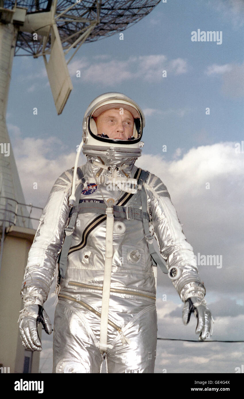 Astronaut John H. Glenn Jr. in his silver Mercury spacesuit during pre- flight training activities at Cape Canaveral. On February 20, 1962 Glenn lifted off into space aboard his Mercury Atlas (MA-6) rocket and became the first American to orbit the Earth. After orbiting the Earth 3 times, Friendship 7 landed in the Atlantic Ocean 4 hours, 55 minutes and 23 seconds later, just East of Grand Turk Island in the Bahamas. Glenn and his capsule were recovered by the Navy Destroyer Noa, 21 minutes after splashdown.  Image # : S64-36914 Date: February 27, 1964 Stock Photo