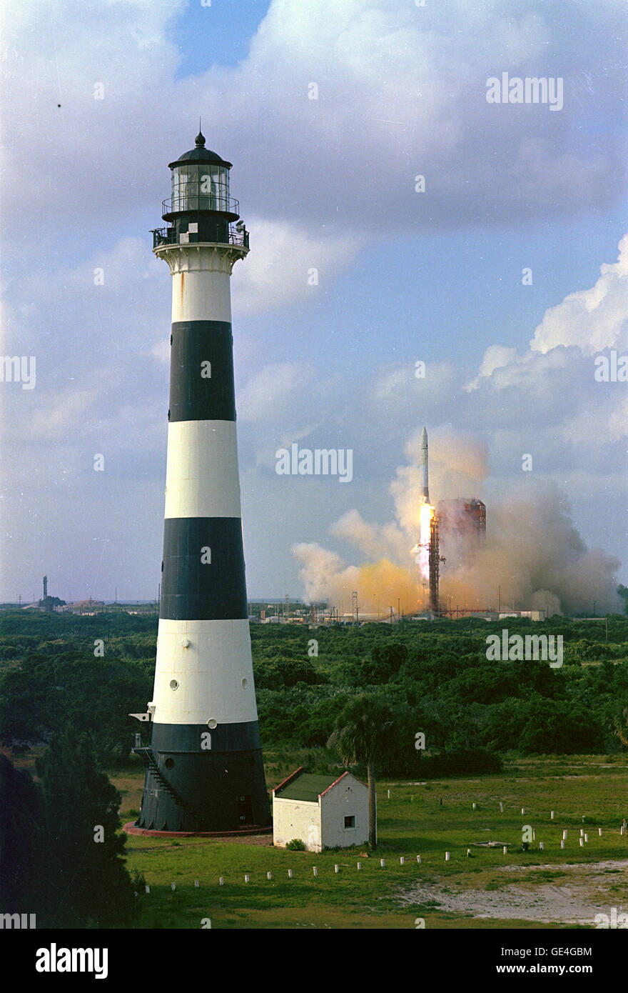 An Atlas-Centaur space vehicle lifted off at 5:53 p.m. EDT, June 13, 1972, from Complex 36B carrying an Intelsat Communications Satellite, (Intelsat IV-F5) into Earth orbit. Visible in the foreground is the lighthouse located at Cape Canaveral Air Force Station.  Image #:  Date: June 13, 1972 Stock Photo