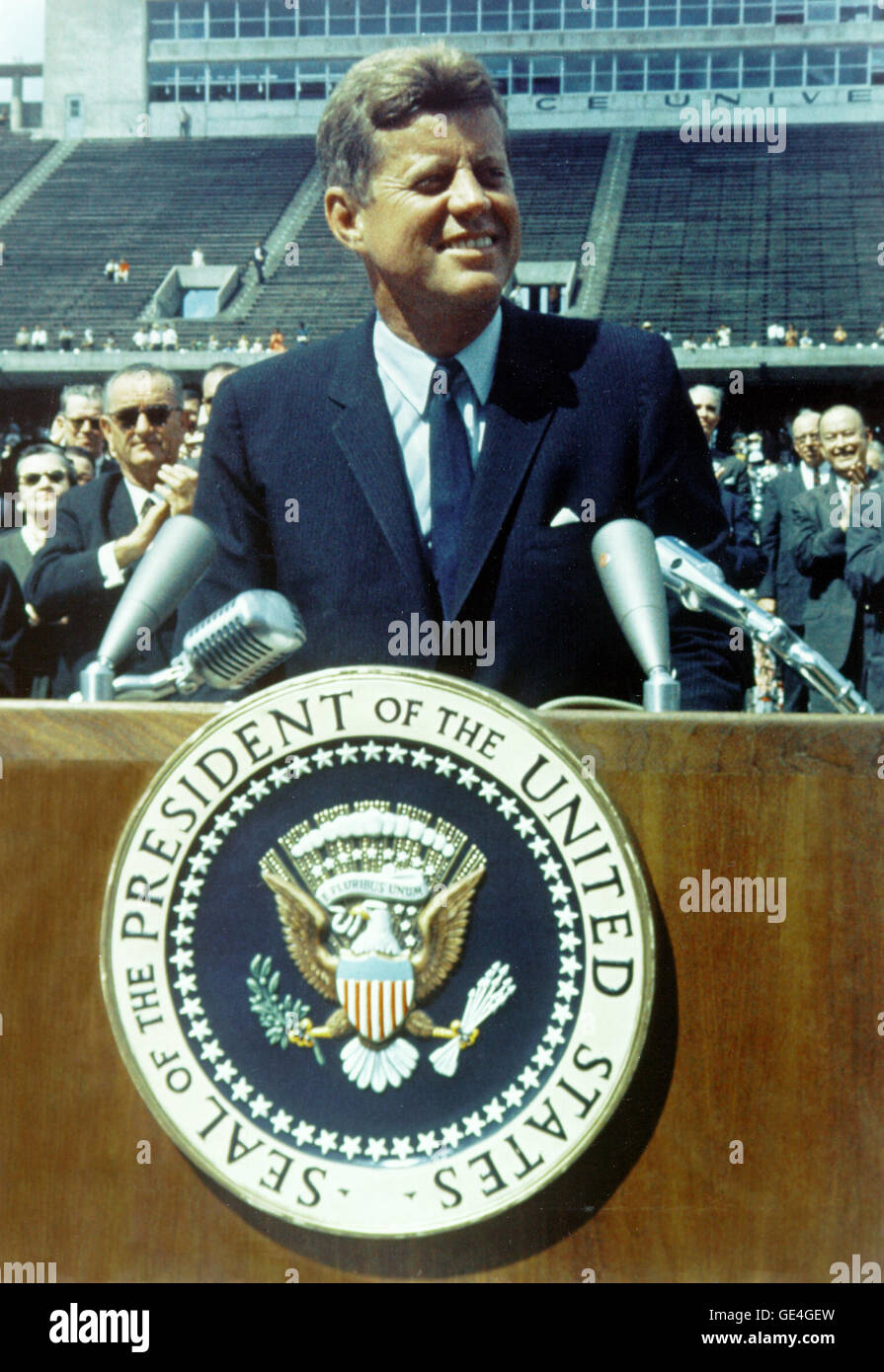 President Kennedy speaks before a crowd of 35,000 people at Rice University in the football field. The following are excerpts from his speech. &quot; ...We set sail on his new sea because there is a new knowledge to be gained, and new rights to be won, and they must be won and used for the progress of all people. ...Whether it will become a force for good or ill depends on man, and only if the United States occupies a position of pre-eminence can we help decide whether this new ocean will be a sea of peace or a new terrifying theater of war. But I do say space can be explored and mastered with Stock Photo