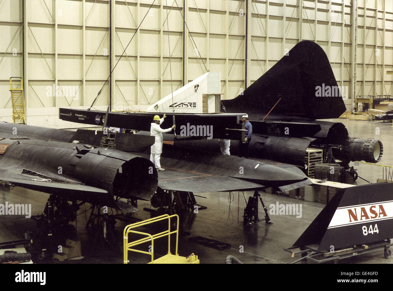 This is a rear/side view of the Linear Aerospike SR Experiment (LASRE) pod on NASA SR-71, tail number 844. This photo was taken during the fit-check of the pod on February 15, 1996, at Lockheed Martin Skunkworks in Palmdale, California. The LASRE experiment was designed to provide in-flight data to help Lockheed Martin evaluate the aerodynamic characteristics and the handling of the SR-71 linear aerospike experiment configuration. The goal of the project was to provide in-flight data to help Lockheed Martin validate the computational predictive tools it was using to determine the aerodynamic p Stock Photo