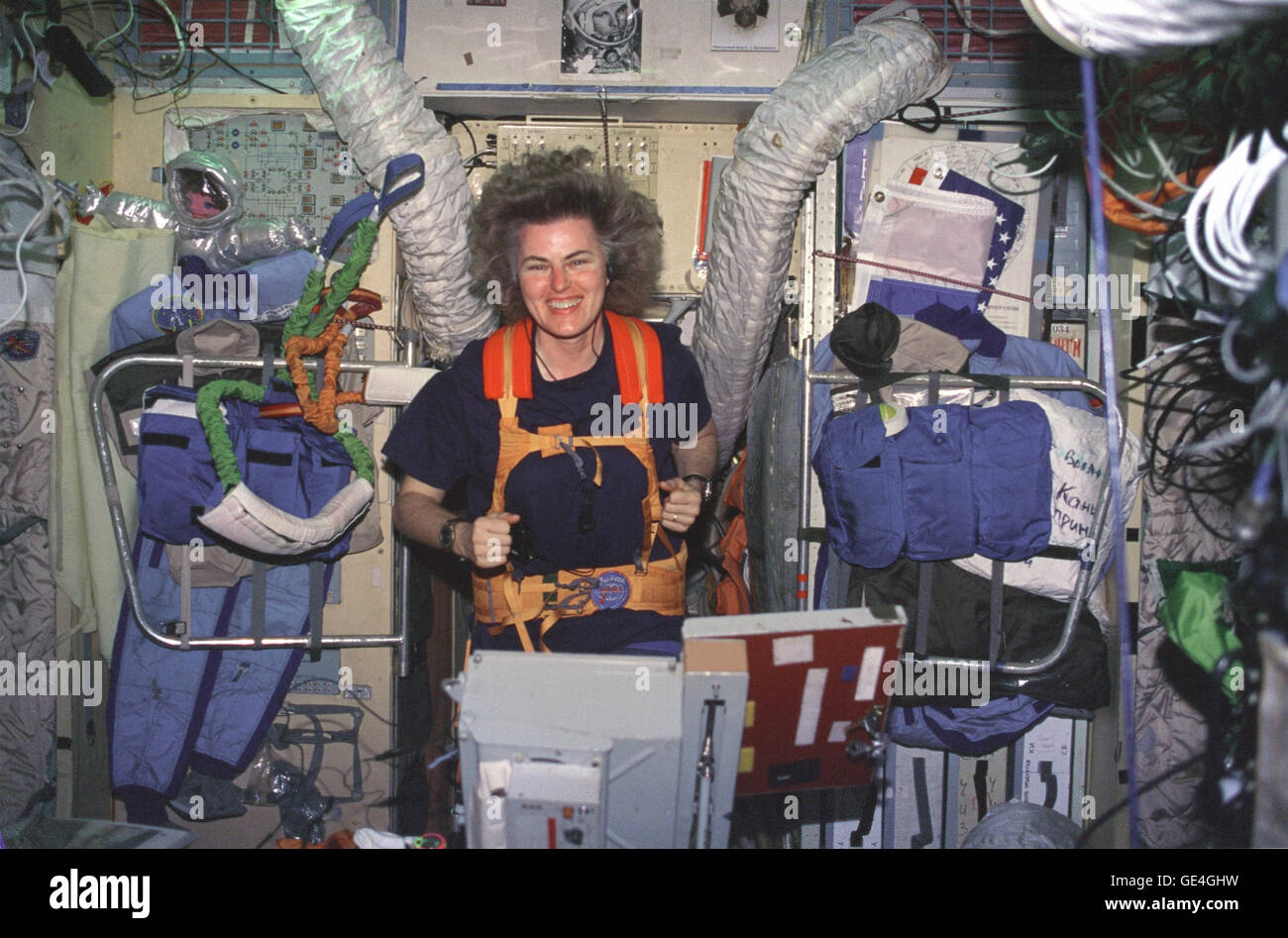 Astronaut Shannon Lucid exercises on a treadmill in the Russian Mir space station Base Block module.   Image # : NM21-399-001  Date: March 28, 1996 Stock Photo