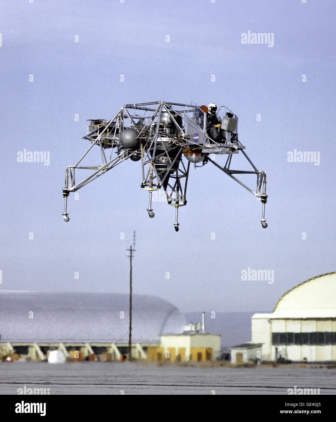 (1964) This 1964 NASA Flight Reserch Center photograph shows the Lunar Landing Research Vehicle (LLRV) Number 1 in flight at the South Base of Edwards Air Force Base. When Apollo planning was underway in 1960, NASA was looking for a simulator to profile the descent to the moon's surface. Three concepts emerged: an electronic simulator, a tethered device, and the ambitious Dryden contribution, a free-flying vehicle. All three became serious projects, but eventually the NASA Flight Research Center's (FRC) Landing Research Vehicle became the most important.   Image # : ECN-506 Stock Photo