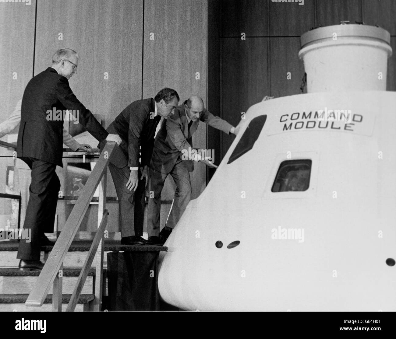 (April 1, 1974) President Richard M. Nixon is given a briefing on the Apollo Command Module similar to the one that will be flown on the upcoming joint U.S./U.S.S.R. Apollo-Soyuz test flight in the summer of 1975. Conducting the tour is the American Commander for the flight, astronaut Thomas P. Stafford. Standing at the President's right is Dr. James C. Fletcher, NASA Administrator.                                                                  Image # : 74-H-236 Stock Photo