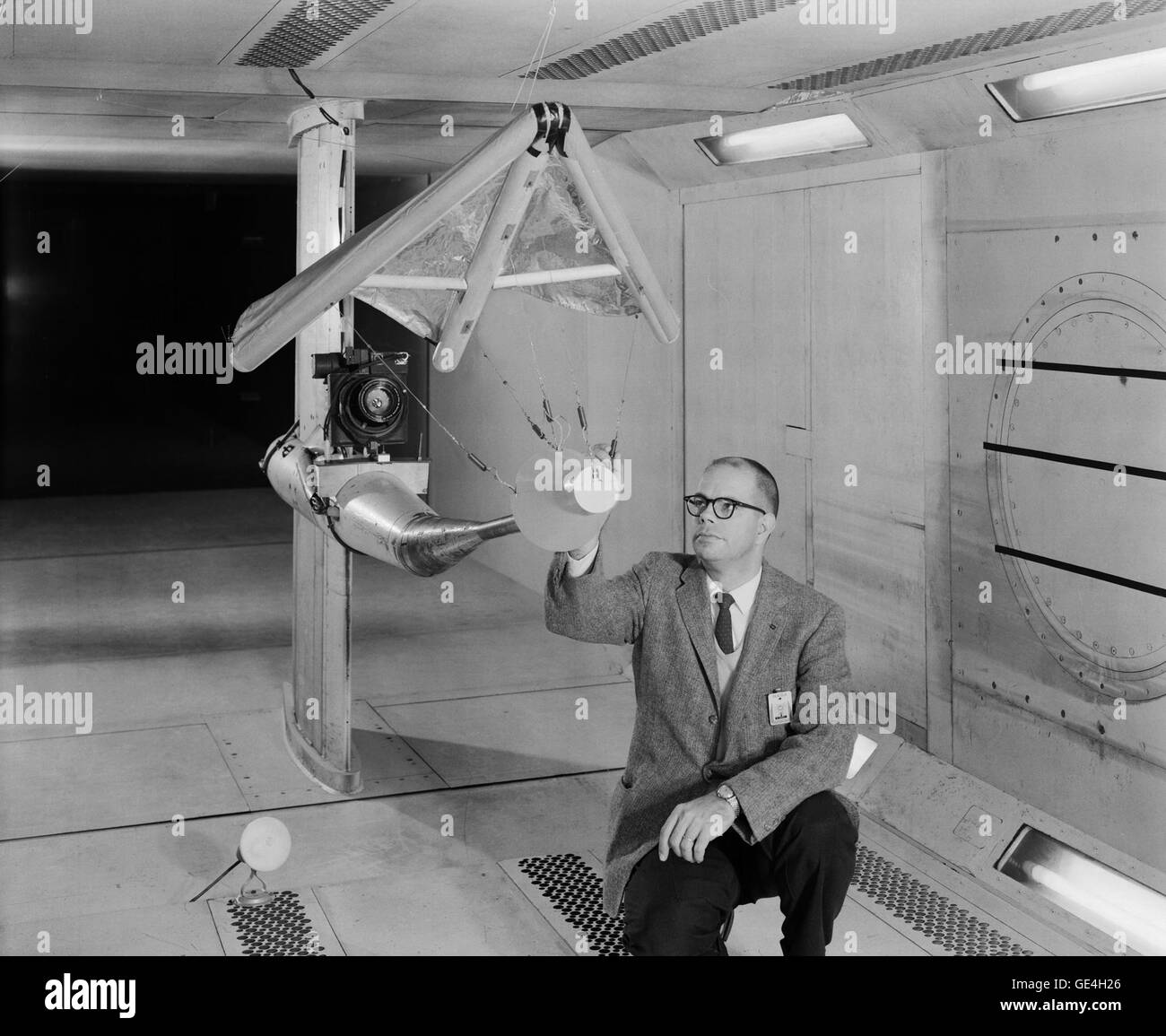 (February 5, 1962) W. C. Sleeman, Jr. inspecting a model of the paraglider in 300 mph 7 x 10 Foot Wind Tunnel. The paraglider, or &quot;Rogallo Wing,&quot; was proposed for use in the Gemini Program. It would have allowed Gemini to make precision landings on land, rather than in the water. But the wing suffered a number of problems. The biggest problem was getting it to deploy properly and reliably. The plan was canceled.   Image # : L-1962-00816 Stock Photo
