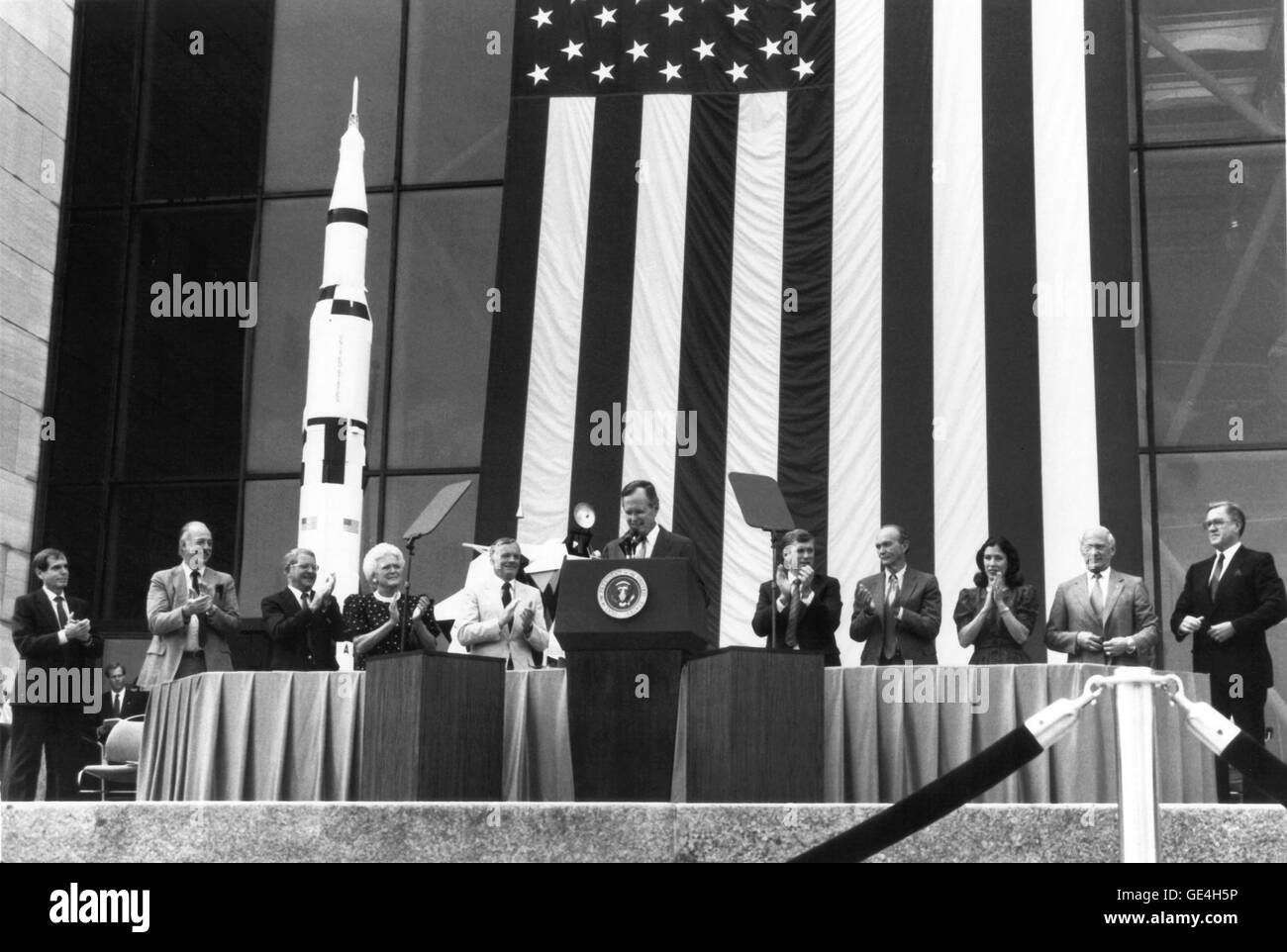 (July 20, 1989) President George Bush speaks at the National Air and Space Museum's 20th anniversary celebration of the Apollo 11 Moon landing. Here, on July 20, 1989, Bush announced his new Space Exploration Initiative, which was to complete the space station, return man to the moon, and bring man to Mars for the first time. The plan fell apart when NASA offered an estimated budget of 500 billion over the next 20 to 30 years to achieve the President's goal. Congress balked, and NASA returned to its earlier program of primarily robotic space exploration. From left to right are NASA Administrat Stock Photo
