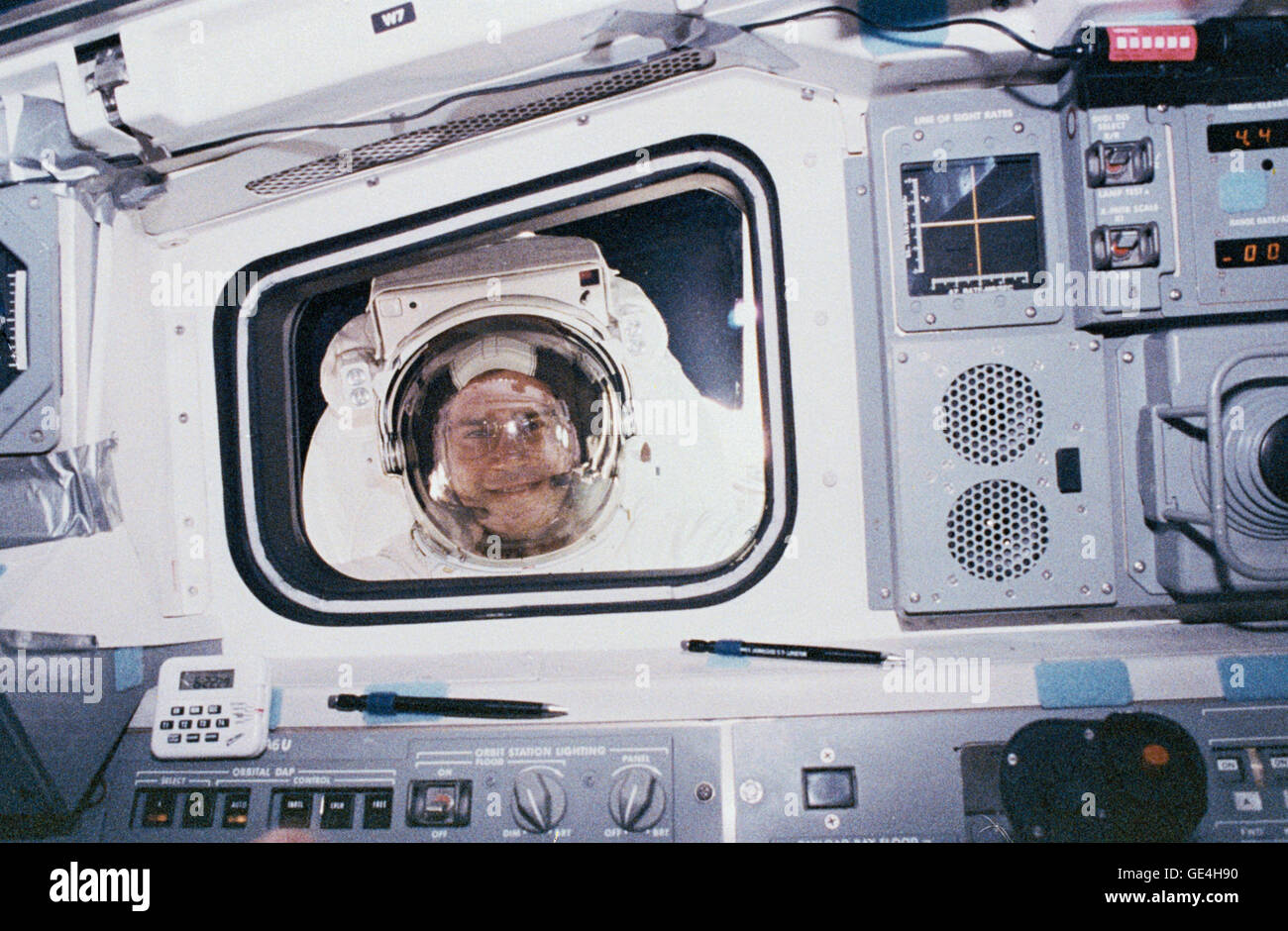 Rick Hieb, a Mission Specialist aboard STS-49, looks into the aft flight deck of the orbiter during his spacewalk. STS-49, which launched on May 7, 1992 and returned:to Earth on May 16, 1992, marked the first flight of Endeavour and the first shuttle mission to feature four EVAs. Hieb, along with fellow astronauts Pierre Thuot and Thomas Akers helped to recover INTELSAT VI, a communications satellite whose orbit had become unstable.   Image #:  Date: May 12, 1992 Stock Photo