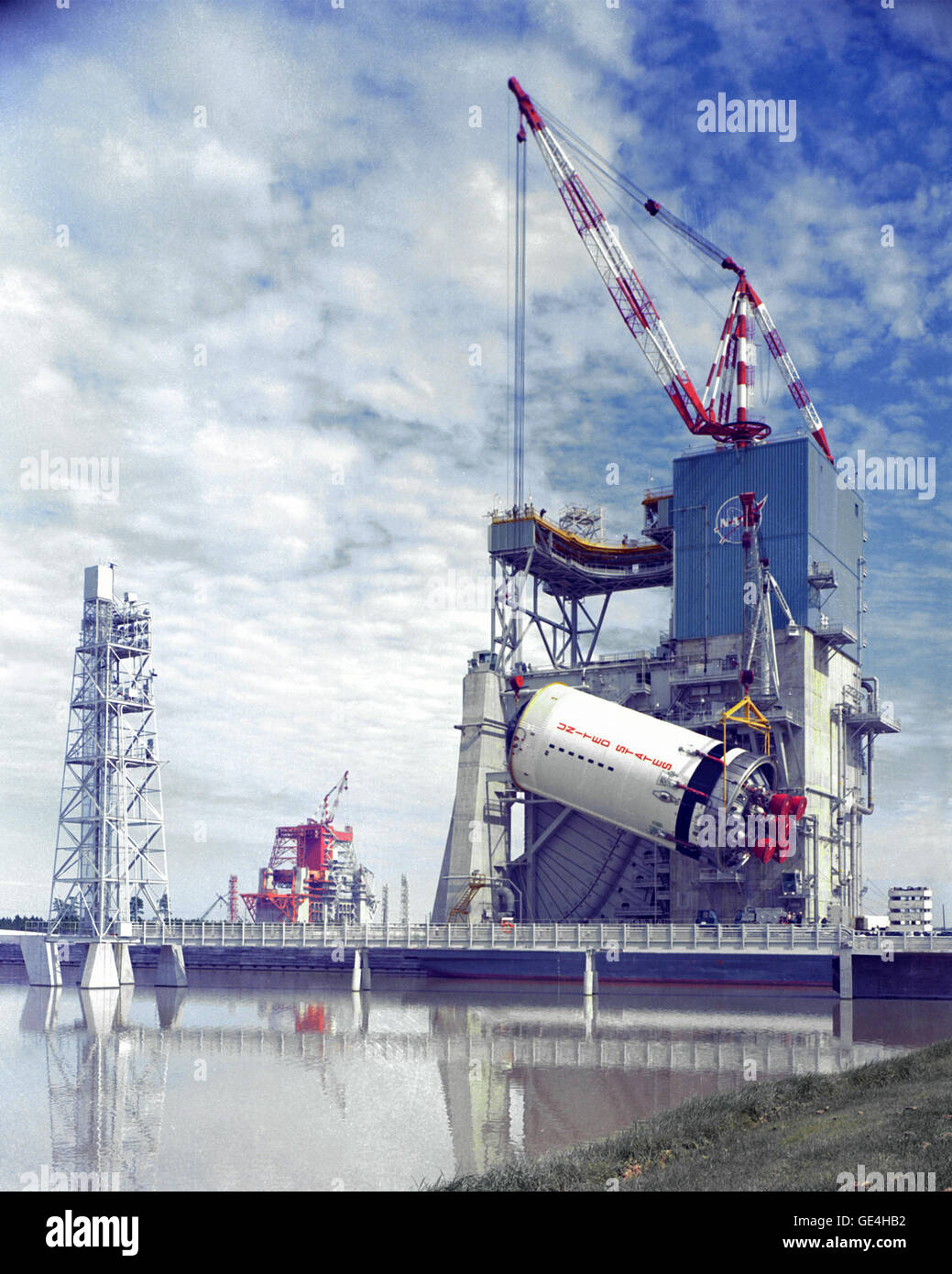 (1967) The S-II stage of the Saturn V rocket is hoisted onto the A-2 test stand in 1967 at the Mississippi Test Facility, now the Stennis Space Center. This was the second stage of the 364-foot tall Moon rocket. The second stage was powered by five J-2 engines.   Image # : 67-701-C Stock Photo