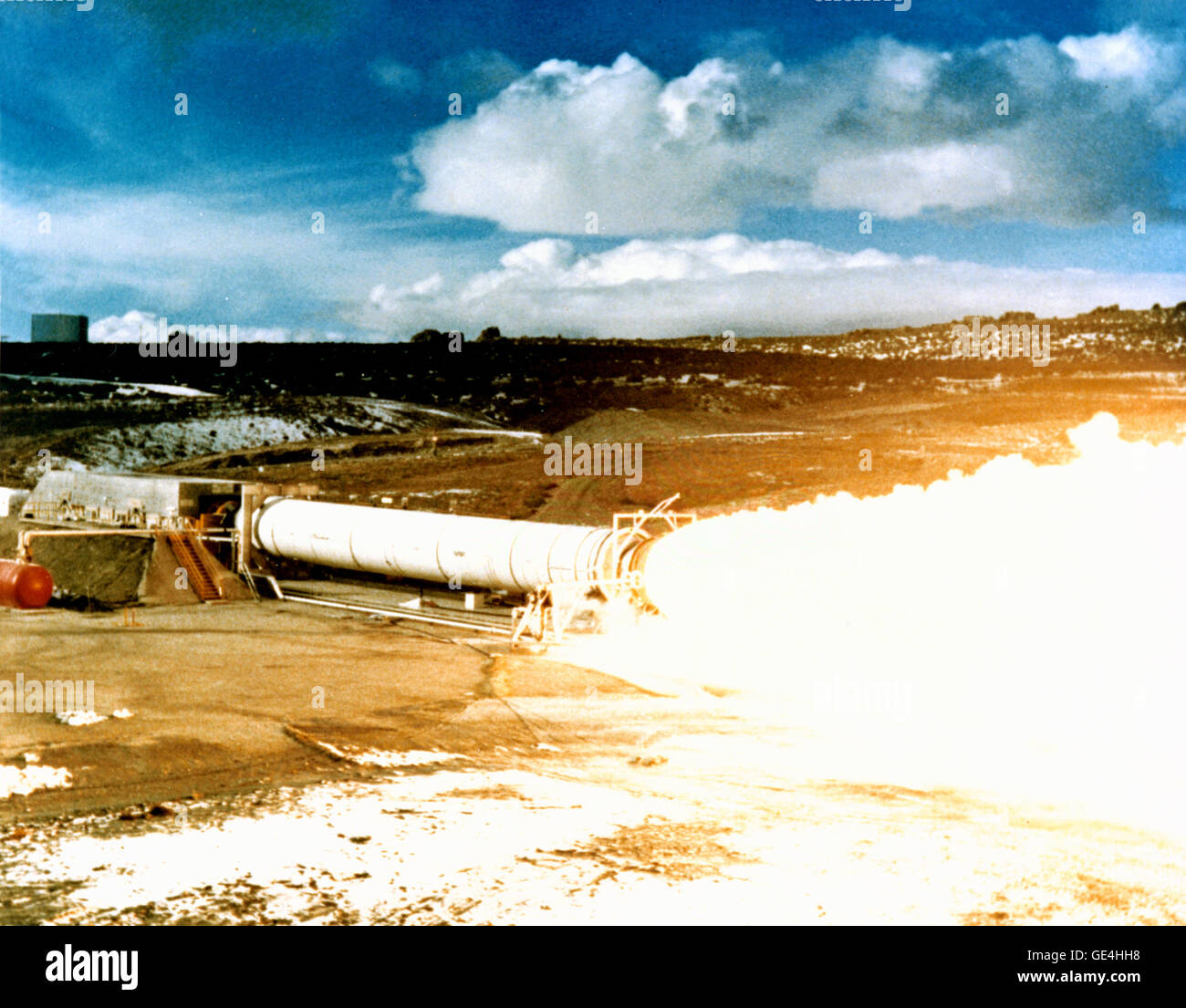 This photograph was taken during the static test firing of the DM-2 (Demonstration Motor) for the Solid Rocket Booster (SRB) at the testing ground of Thiokol Corporation near Brigham City, Utah. As one of the major components of the Space Shuttle, SRBs provide most of the power, their combined thrust of some 5.8 million pounds, for the first two minutes of flight. The SRBs took the Space Shuttle to an altitude of 28 miles and a speed of 3,094 miles per hour before they separated and fell back into the ocean to be retrieved, refurbished, and prepared for another flight. Marshall Space Flight Ce Stock Photo