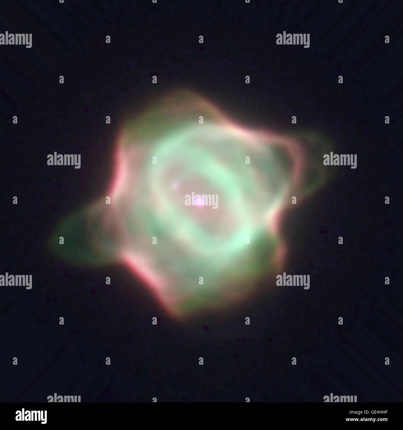 (March 1, 1996) This Wide Field and Planetary Camera 2 image captures the infancy of the Stingray nebula (Hen-1357), the youngest known planetary nebula. In this image, the bright central star is in the middle of the green ring of gas. Its companion star is diagonally above it at 10 o'clock. A spur of gas (green) is forming a faint bridge to the companion star due to gravitational attraction. The image also shows a ring of gas (green) surrounding the central star, with bubbles of gas to the lower left and upper right of the ring. The wind of material propelled by radiation from the hot central Stock Photo