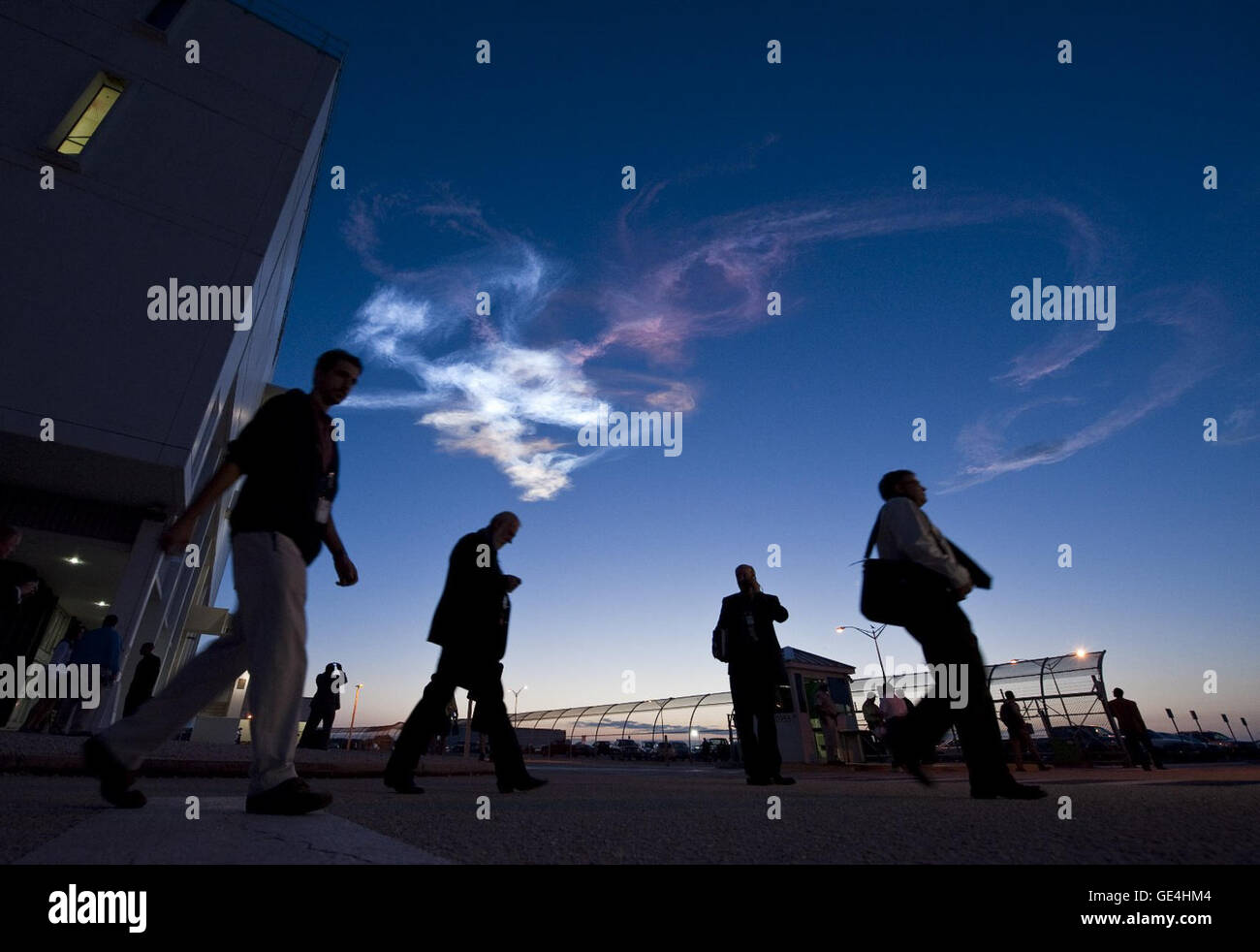 Contrails are seen as workers leave the Launch Control Center after the launch of the space shuttle Discovery and the start of the STS-131 mission at NASA Kennedy Space Center in Cape Canaveral, Fla. on Monday April 5, 2010. Discovery is carrying a multi-purpose logistics module filled with science racks for the laboratories aboard the station. The mission has three planned spacewalks, with work to include replacing an ammonia tank assembly, retrieving a Japanese experiment from the stationÕs exterior, and switching out a rate gyro assembly on the stationÕs truss structure. Photo Credit: (NASA Stock Photo