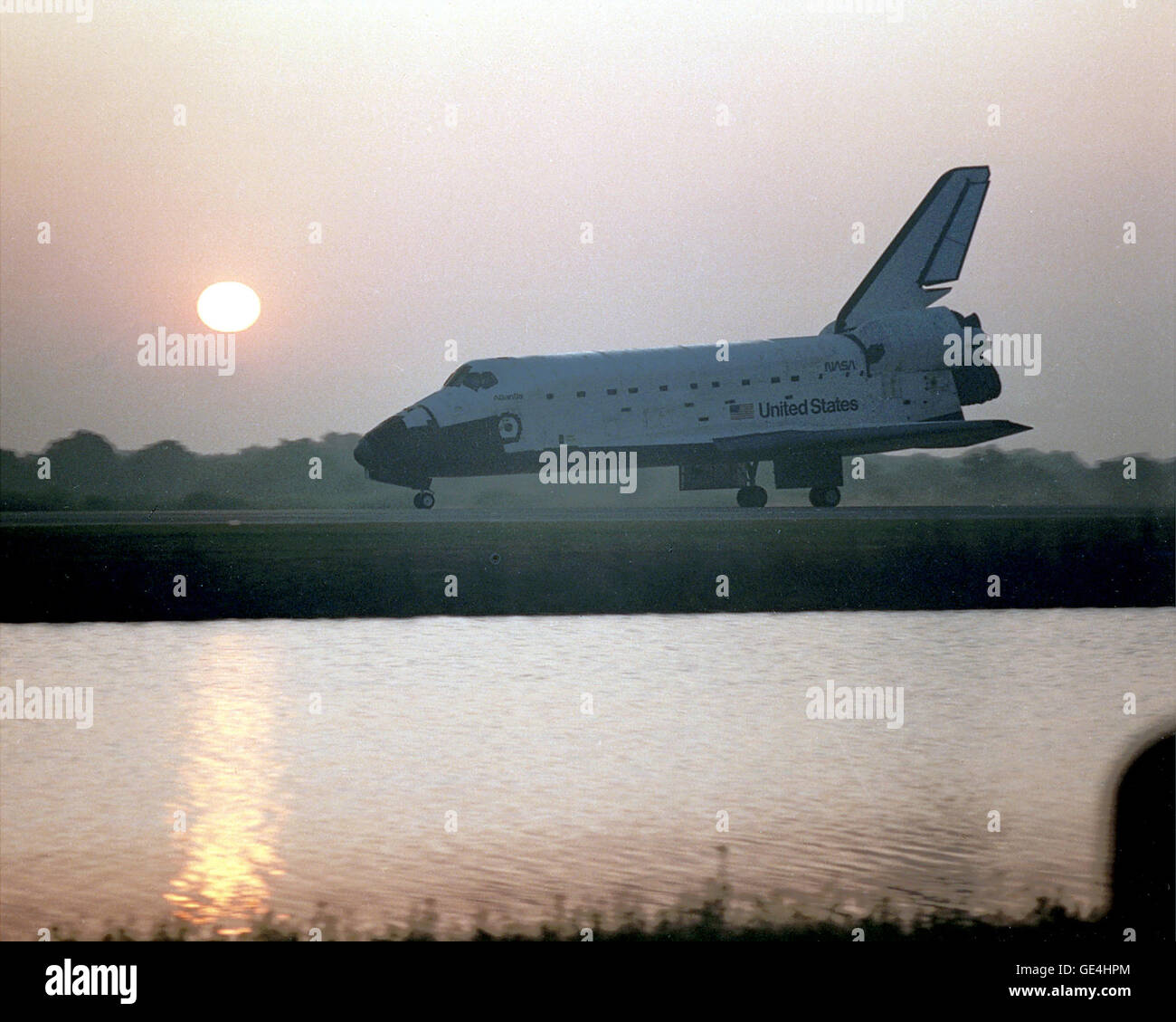 As the sun rises the morning of April 2, it casts a rosy glow over a steller performer, the orbiter Atlantis parked on Runway 33 of the Shuttle Landing Facility. Atlantis touched down at 6:23:6 a.m. EST, completing a highly successful flight that was extended by a day to further the scientific research being performed on the Atmospheric Laboratory for Applications and Science-1 (ATLAS-1) payload. On board OV-104 for Mission STS-45 was a crew of seven.   Image # : 92PC-0724 Stock Photo
