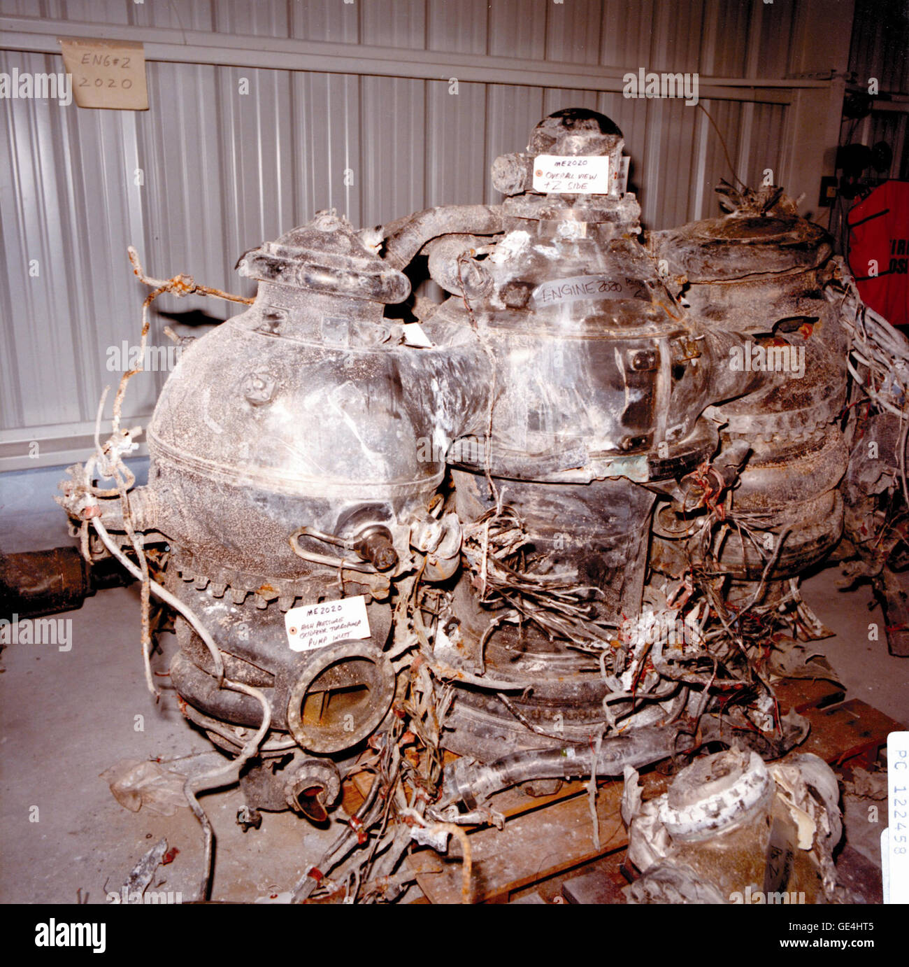 On January 28, 1986, the Space Shuttle Challenger and her seven-member crew were lost when a ruptured O-ring in the right Solid Rocket Booster caused an explosion soon after launch. Search and recovery teams lifted the Space Shuttle Main Engines (SSME) from the ocean after the accident and brought them to a storage building in Kennedy Space Center's Complex 39. Although impact with the ocean damaged some valves, the positions of others suggest that the SSME continued to operate until the orbiter breakup and thus played no part in initiating the explosion.   Image #:  Date: March 6, 1986 Stock Photo