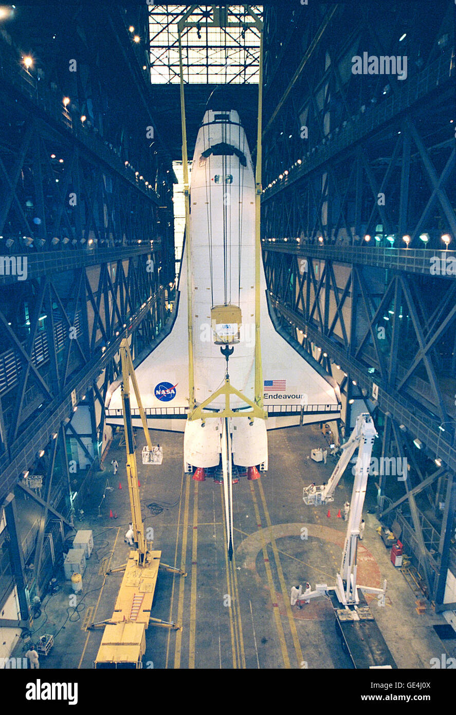 The orbiter Endeavour is suspended in a vertical position inside the Vehicle Assembly Building where it will be mated with its solid rocket boosters and external tank. Endeavour is scheduled to fly on mission STS-88, the first Space Shuttle flight for the assembly of the International Space Station, on December 3, 1998. The primary payload on the mission is the Unity connecting module, which will be mated to the Russian-built Zarya Control Module already in orbit at that time.   Image # : 98PC-1341 Stock Photo
