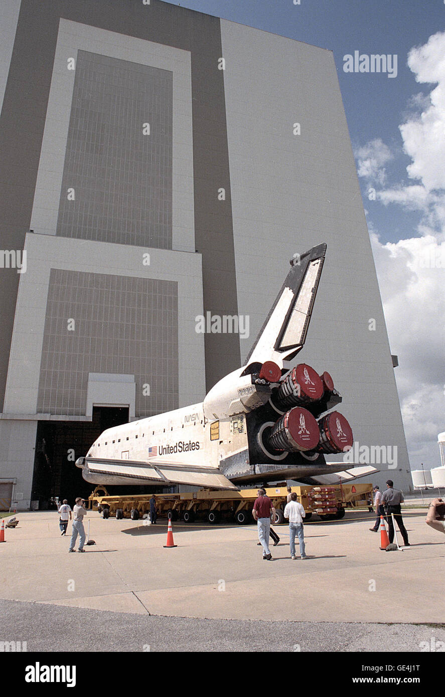 The orbiter Columbia, aboard its orbiter transporter system, rolls toward the opening in the Vehicle Assembly Building where it was mated with the external tank mating in preparation for mission STS-93. The primary mission objective was the deployment of the Advanced X-ray Astrophysics Facility, renamed the Chandra X-Ray Observatory. Mission STS-93 was the first commanded by a woman, Colonel Eileen M. Collins.  The mission launched on July 23, 1999.  Image #: 99PP-0616 Date: June 2, 1999 Stock Photo