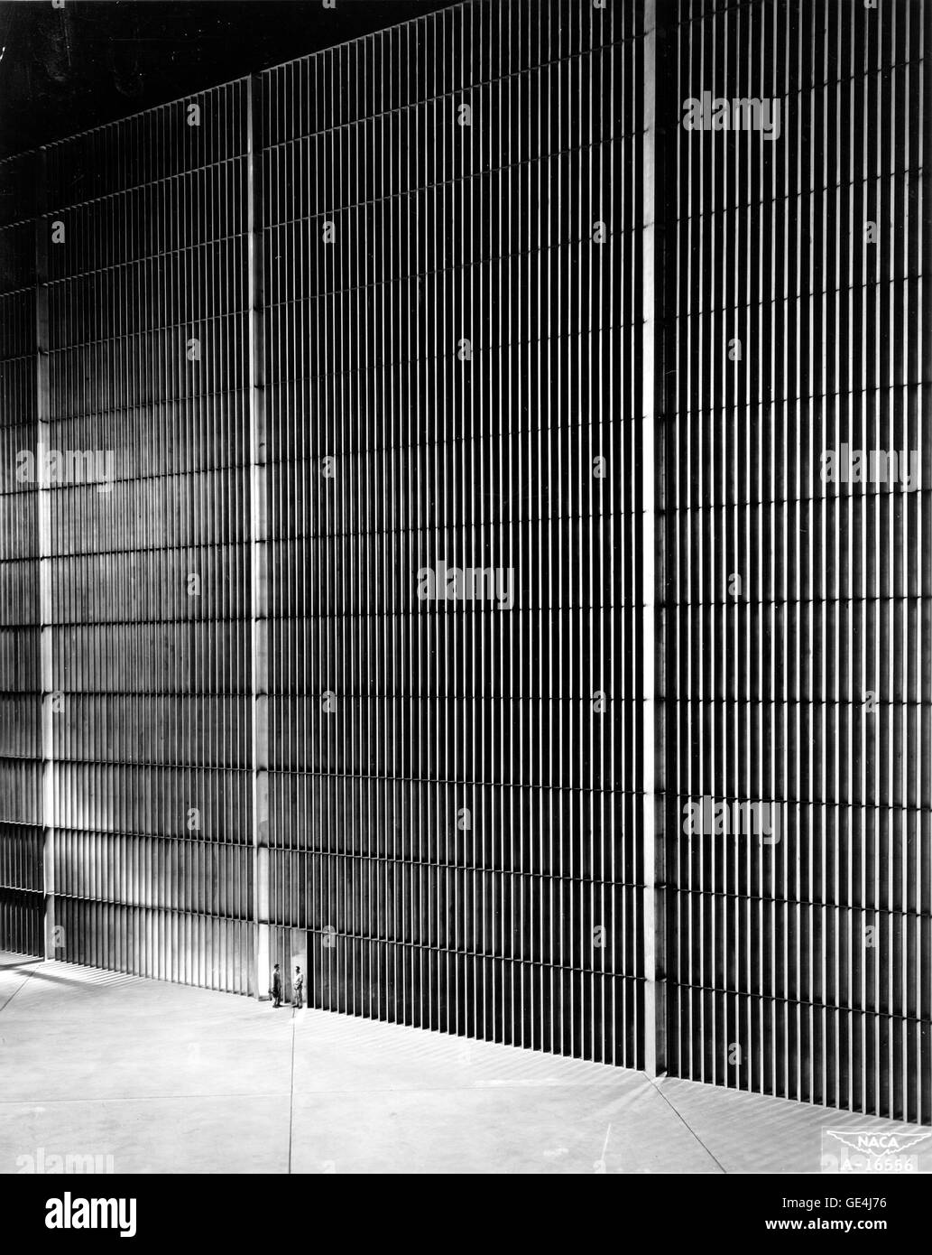 As tall as a 10 story building, this towering bank of vanes turns the air smoothly around one of the four corners of the world's largest wind tunnel. This tunnel which has a test section 40 feet high and 80 feet wide, is operated by the NACA's Ames Aeronautical Laboratory at Moffett Field, California. With a maxium air speed of 250 miles per hour, the 40 by 80 foot tunnel is proving very valuable in studying the low speed problems arising from new aircraft wing shapes designed for flight near or above the speed of sound. The tunnel structure covers eight acres and at the point shown in this ph Stock Photo