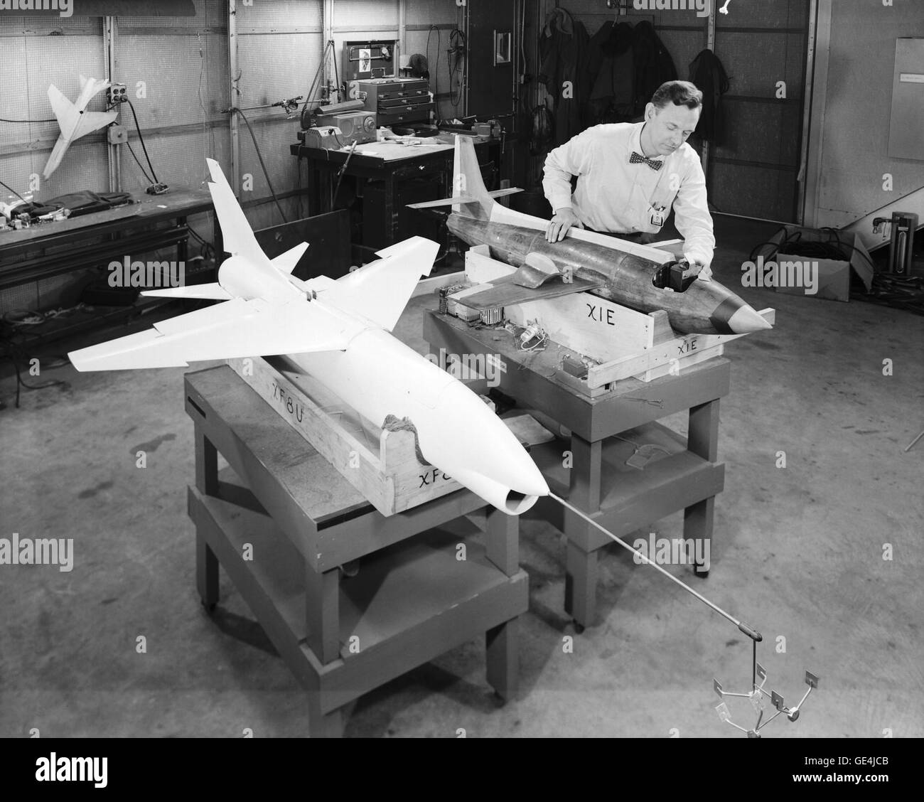 A technician prepares dynamic models of the Bell X-1E and the Vought XF-8U Crusader for wind tunnel testing in 1957. The Crusader was then the Navy's fastest aircraft (maximum speed Mach 1.75 at 35,000 feet).   February 19, 1957 Stock Photo
