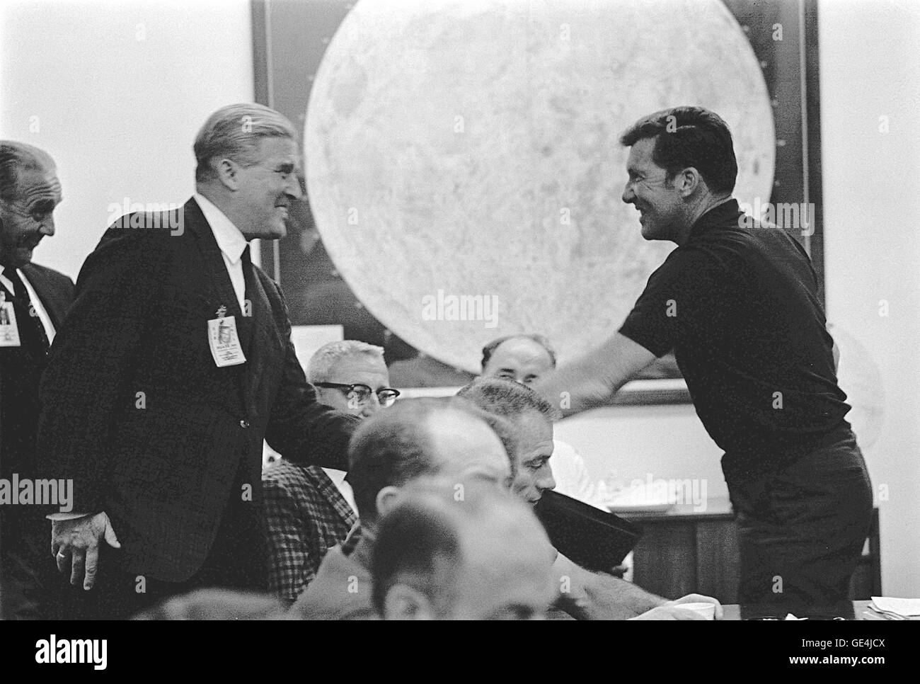 (October 10, 1968) Apollo 7 Commander Walter M. Schirra, Jr., left, greets Dr. Wernher Von Braun, Director, Marshall Space Flight Center and Dr. Kurt Debus, Right, KSC Director, during a prelaunch mission briefing held at the Florida Spaceport.  Image # : 68P-0405 Stock Photo