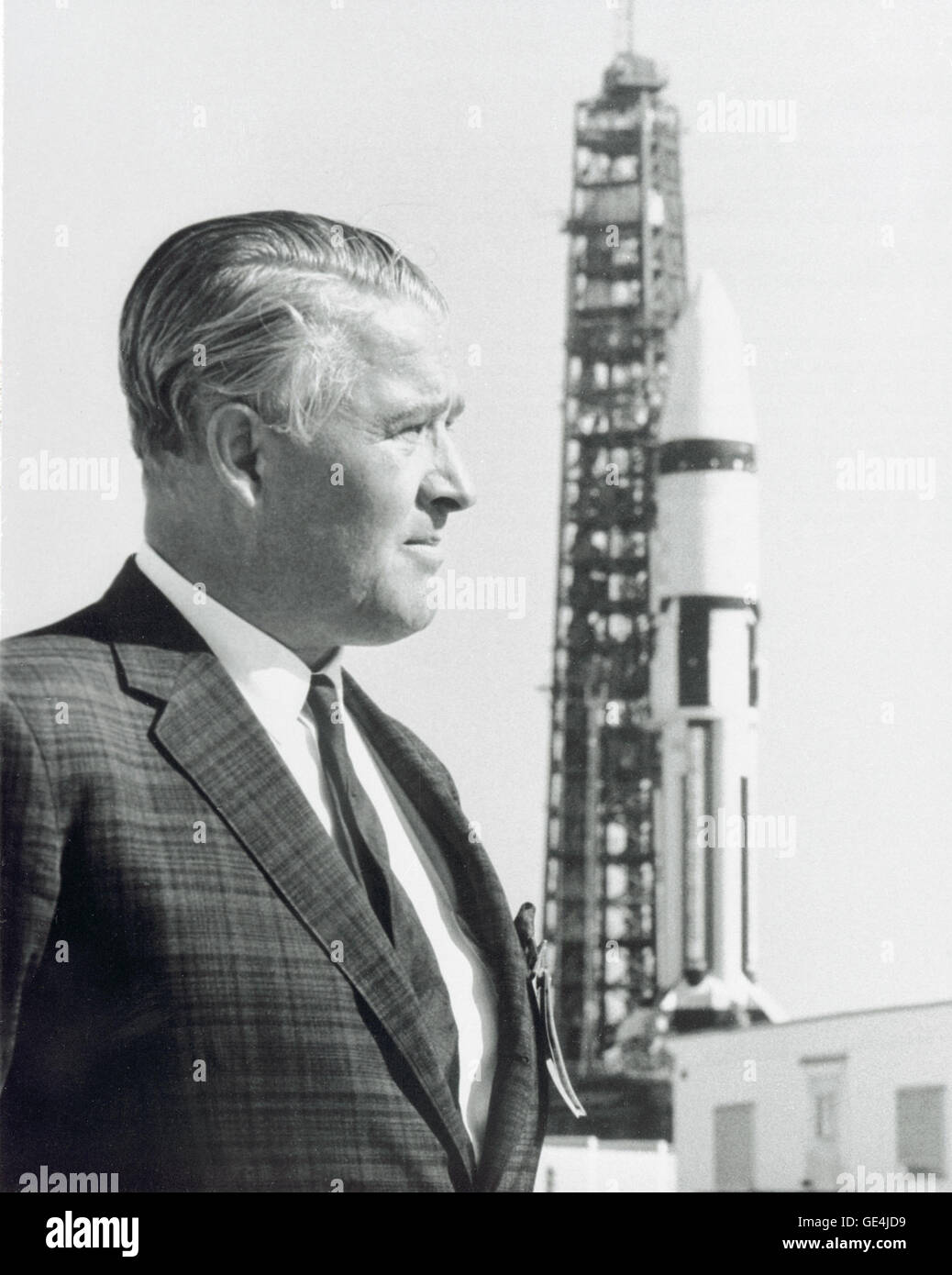 Dr. Wernher von Braun stands in front of a Saturn IB launch vehicle at Kennedy Space Flight Center. Dr. von Braun led a team of German rocket scientists, called the Rocket Team, to the United States, first to Fort Bliss/White Sands, later being transferred to the Army Ballistic Missile Agency at Redstone Arsenal in Huntsville, Alabama. They were further transferred to the newly established NASA/Marshall Space Flight Center (MSFC) in Huntsville, Alabama in 1960, and Dr. von Braun became the first Center Director. Under von Braun's direction, MSFC developed the Mercury-Redstone, which put the fi Stock Photo