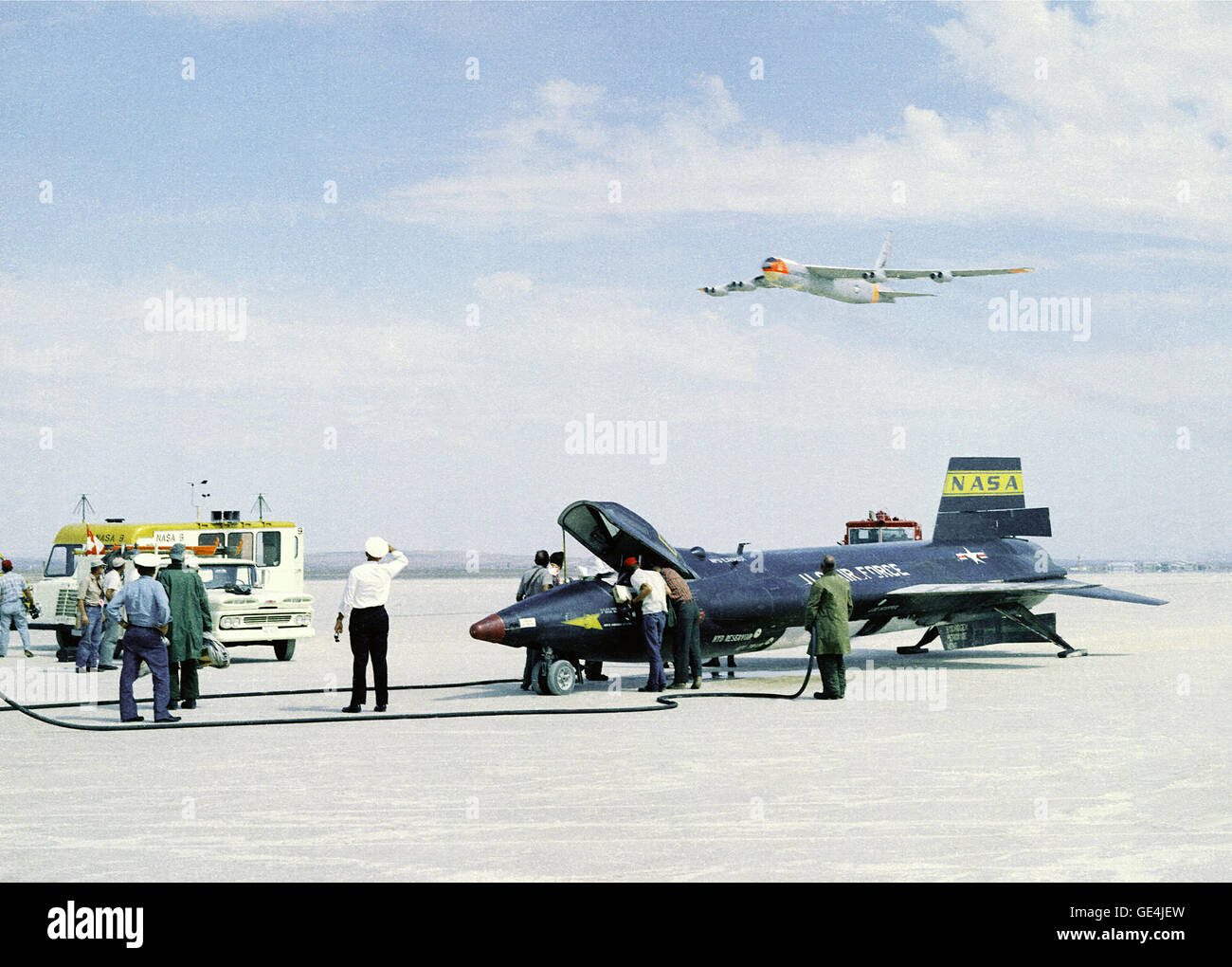 (September 1, 1961) As crew members secure the X-15 rocket-powered aircraft after a research flight, the B-52 mothership used for launching this unique aircraft does a low fly-by overhead. The X-15s made a total of 199 flights over a period of nearly 10 years from 1959 to 1968, and set unofficial world speed and altitude records of 4,520 mph (Mach 6.7) and 354,200 feet. Information gained from the highly successful X-15 program contributed to the development of the Mercury, Gemini, and Apollo piloted spaceflight programs, and also the Space Shuttle program.   Image # : EC-61-0034 Stock Photo