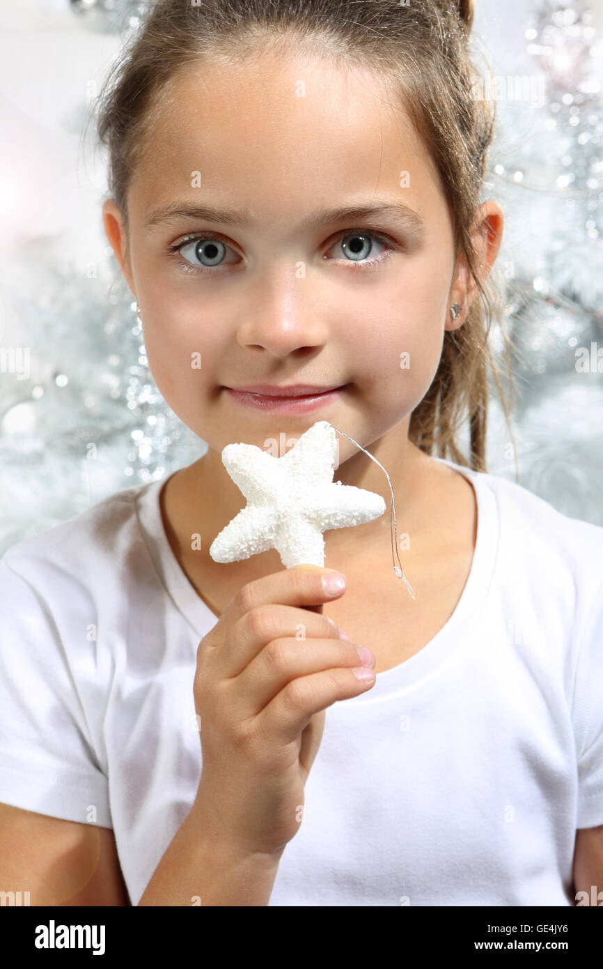 Girl with Christmas star Stock Photo Alamy