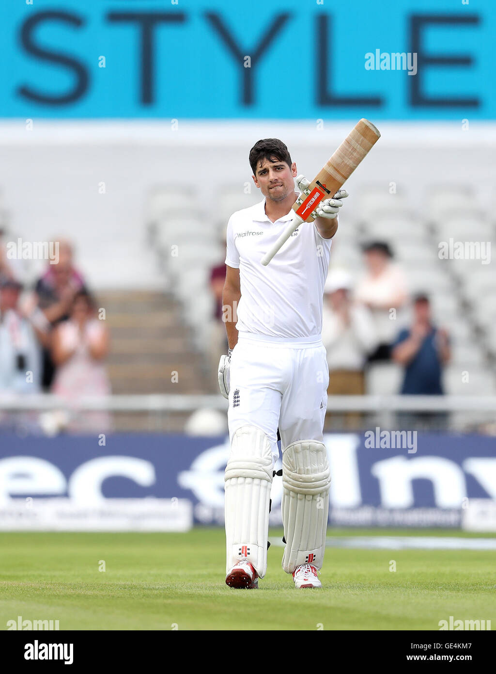 England's Alastair Cook celebrates making his century against Pakistan during day one of the Second Investec Test match at Emirates Old Trafford, Manchester. Stock Photo