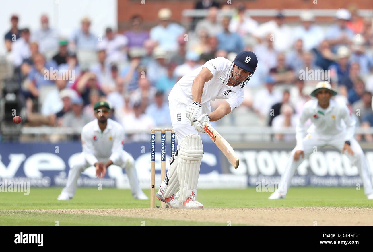 England's Alastair Cook hits the runs to complete his century against Pakistan during day one of the Second Investec Test match at Emirates Old Trafford, Manchester. Stock Photo