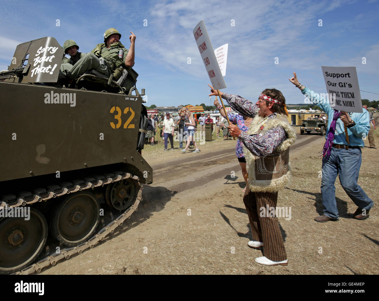 NOTE GESTURE Members of the Rolling Thunder re-enactment group pose as U.S. Military personnel and peace activists as the War and Peace Revival continues near Folkestone, Kent. Stock Photo