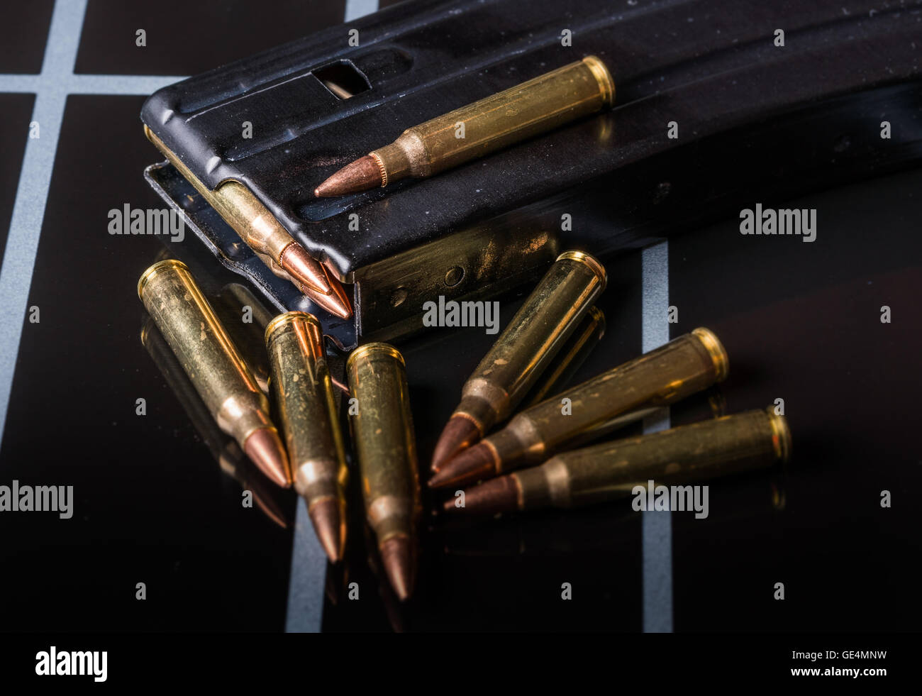 Ammunition in Magazine .223/556 on Black Surface Stock Photo